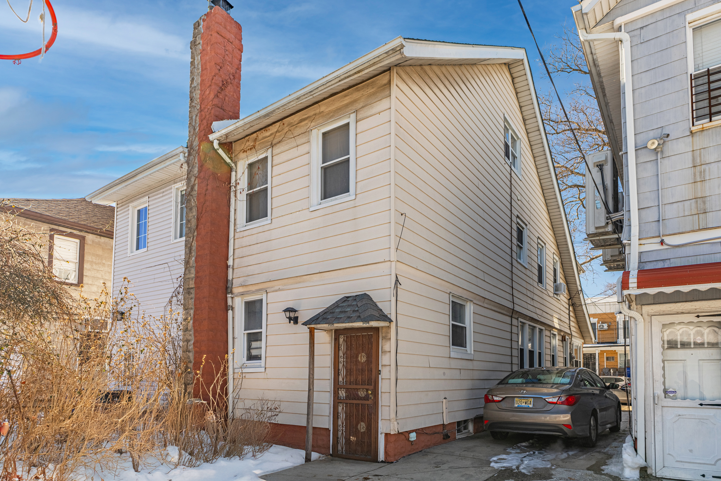 961 East 32nd Street Brooklyn, NY 11210 - Photo 19 of 24 a front view of a house with parking space