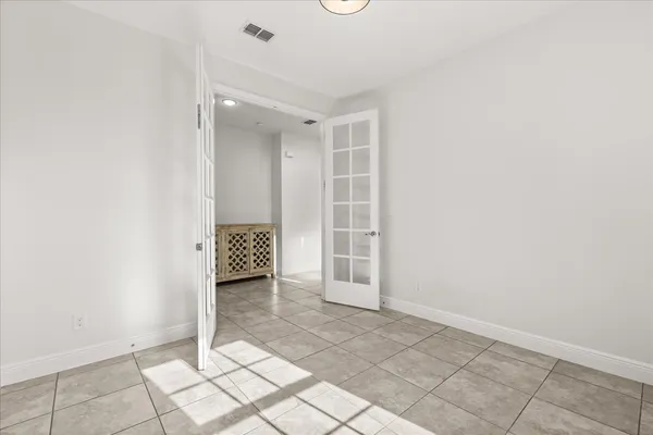 a bathroom with a shower sink and mirror