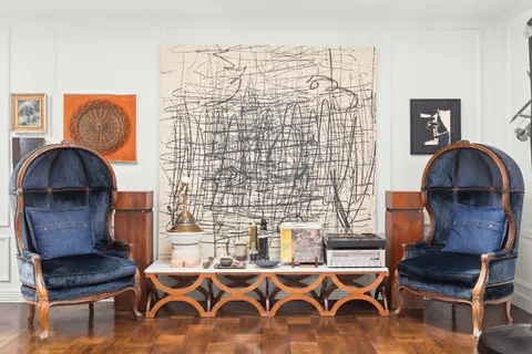 a workspace with furniture and a lamp