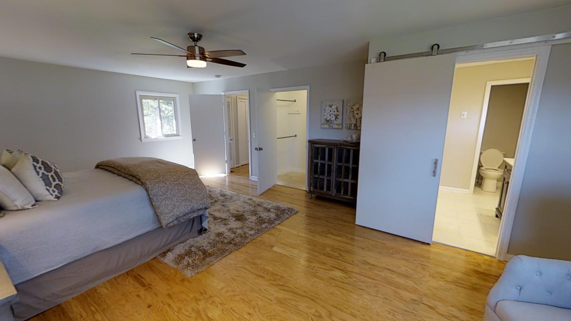 4425 Prescott Road Nashville, TN 37204 - Photo 11 of 26 a spacious bedroom with a bed and a walk in closet