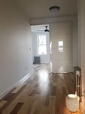 a view of an empty room and a window