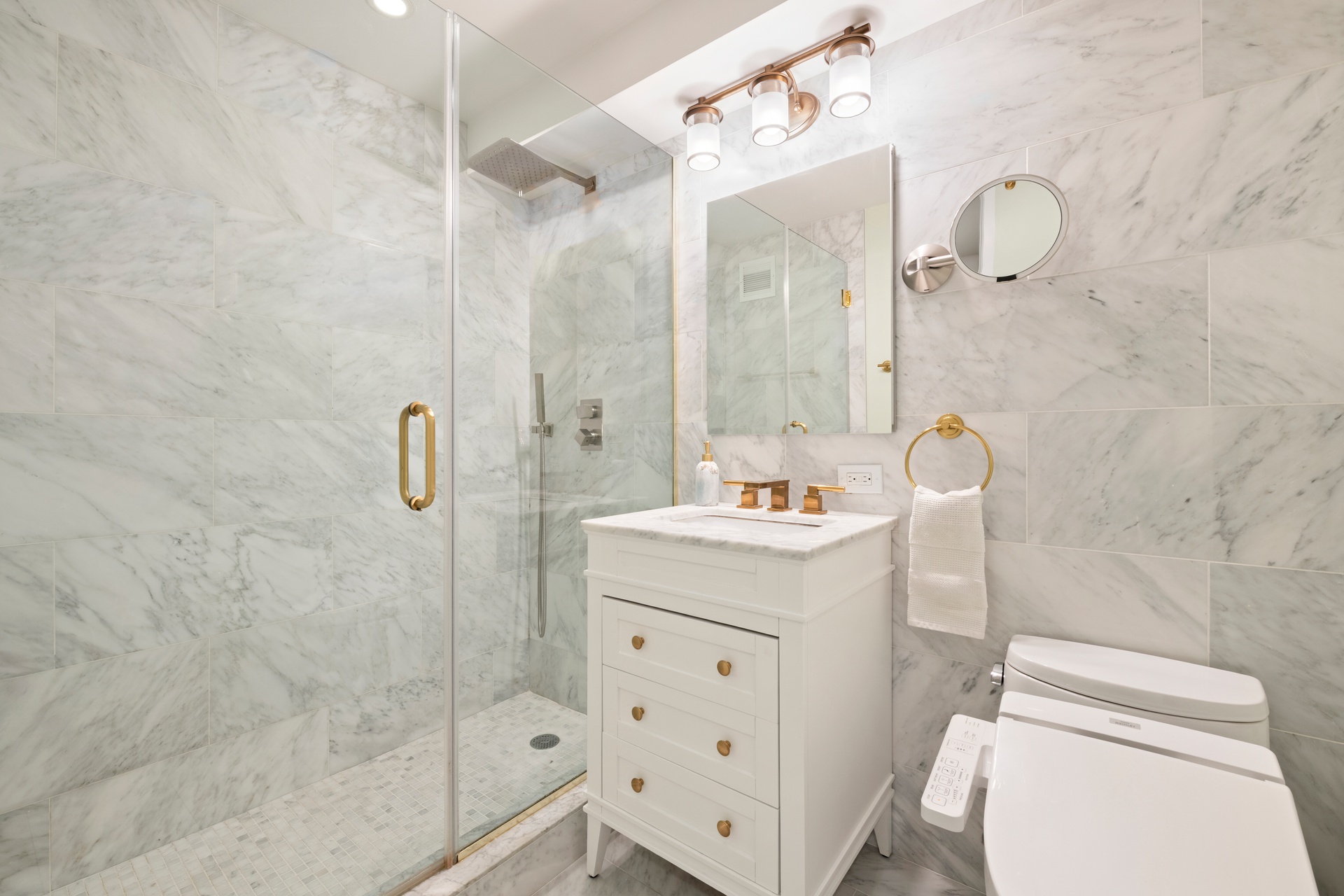 70 East 10th Street, Unit 4V Manhattan, NY 10003 - Photo 17 of 26 a bathroom with a sink a toilet and shower