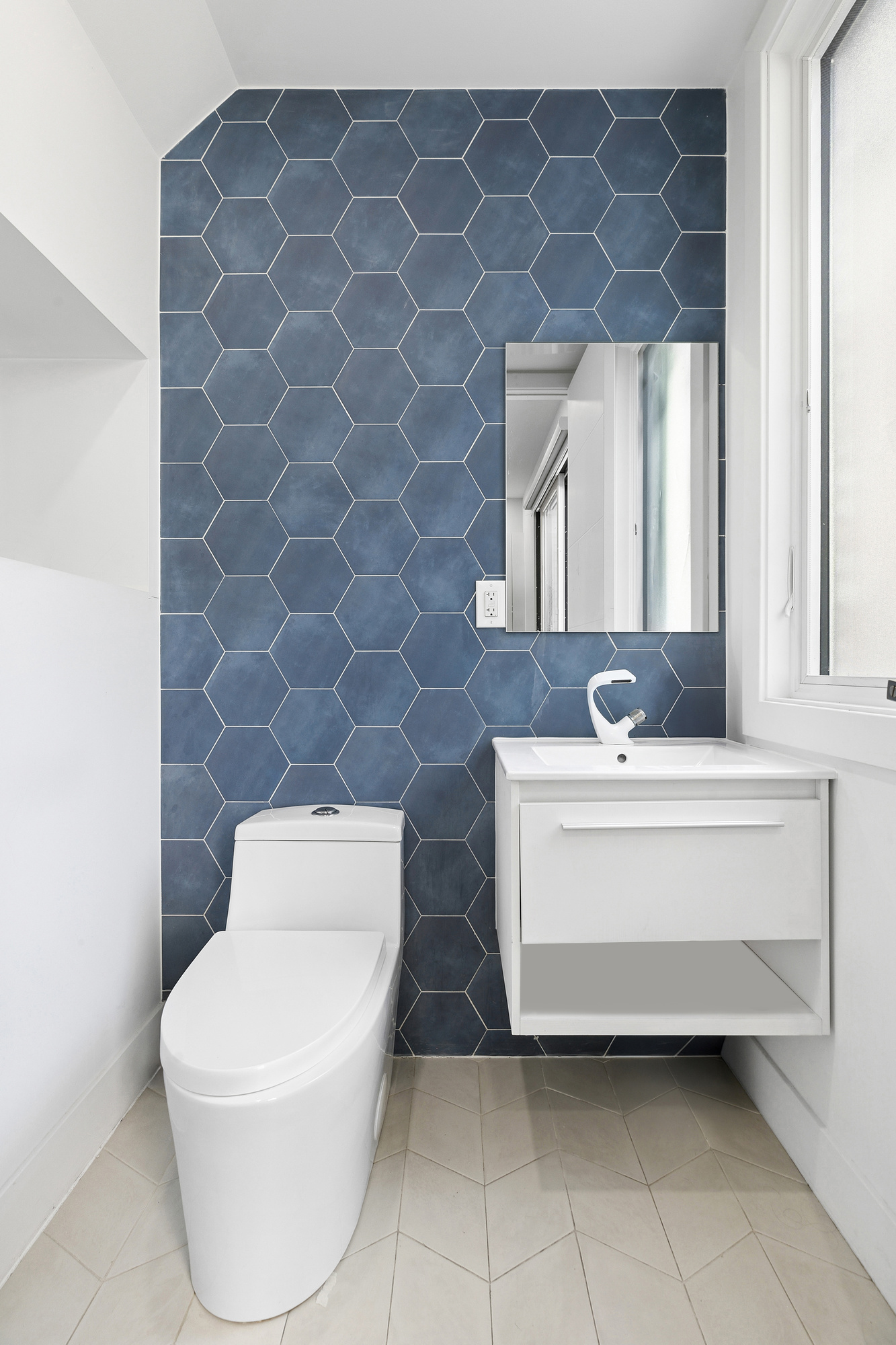 483 Hart Street, Unit 1 Brooklyn, NY 11221 - Photo 16 of 18 a bathroom with a toilet a sink and mirror