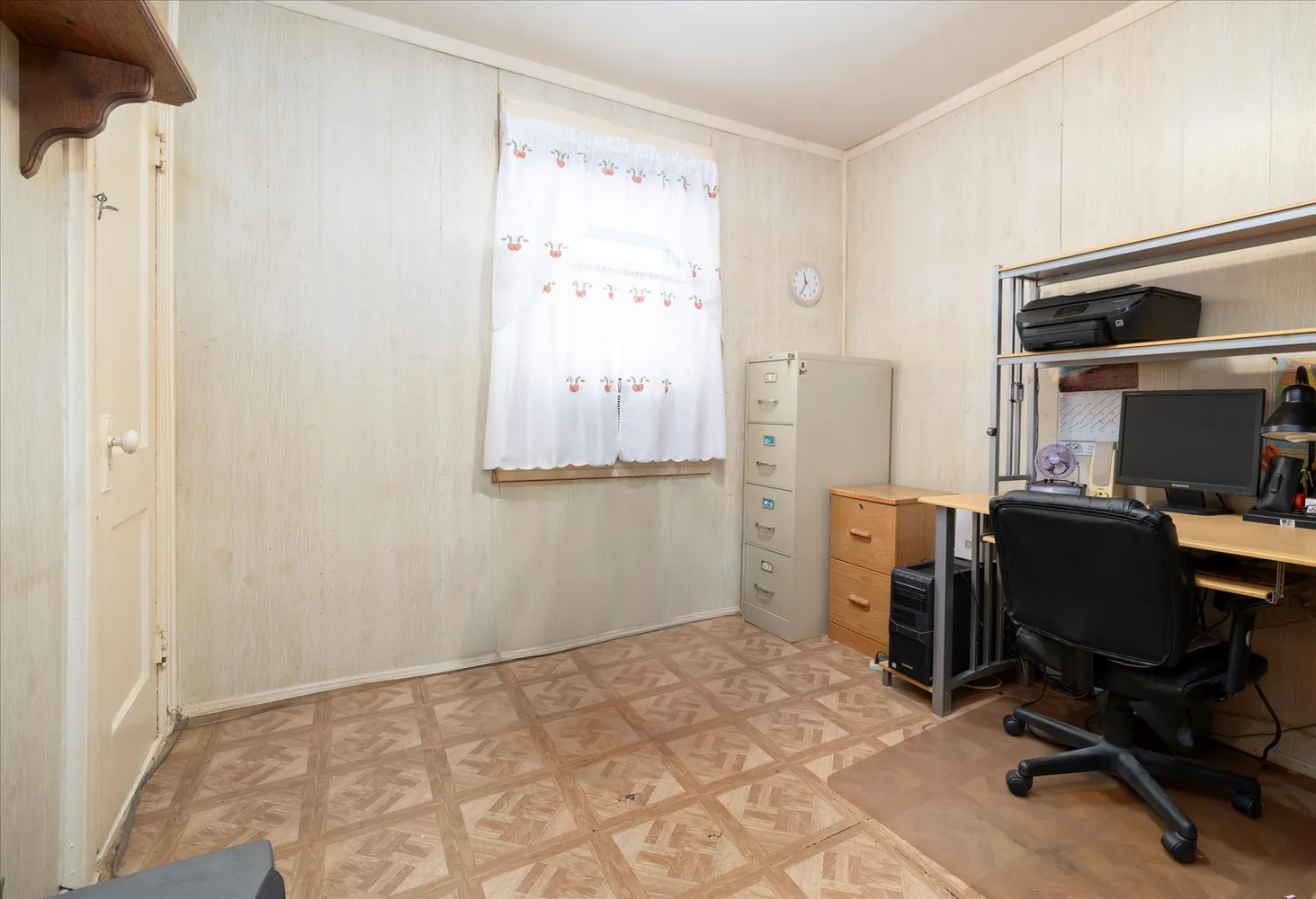 a bedroom with a workspace