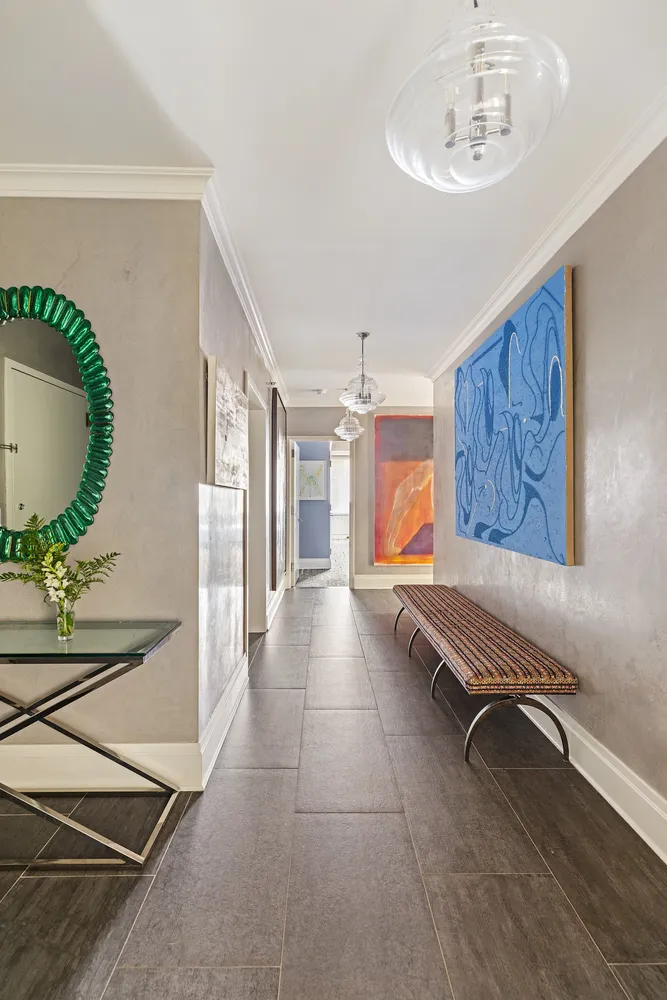 a view of a room with furniture and wooden floor