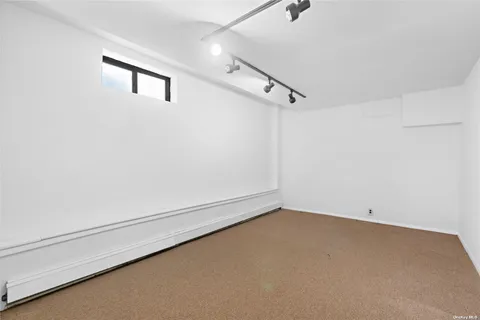 a bathroom with a toilet a sink a mirror and bathtub