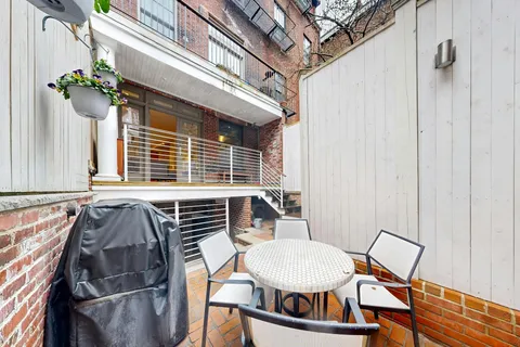 a view of a room that has a table and chairs
