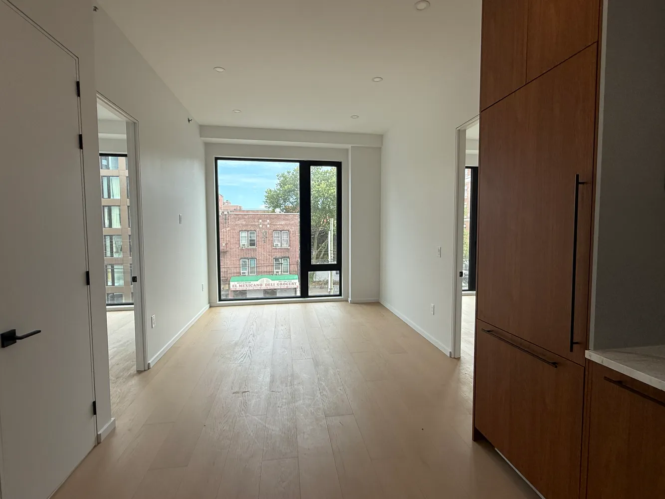 a view of an empty room with a window