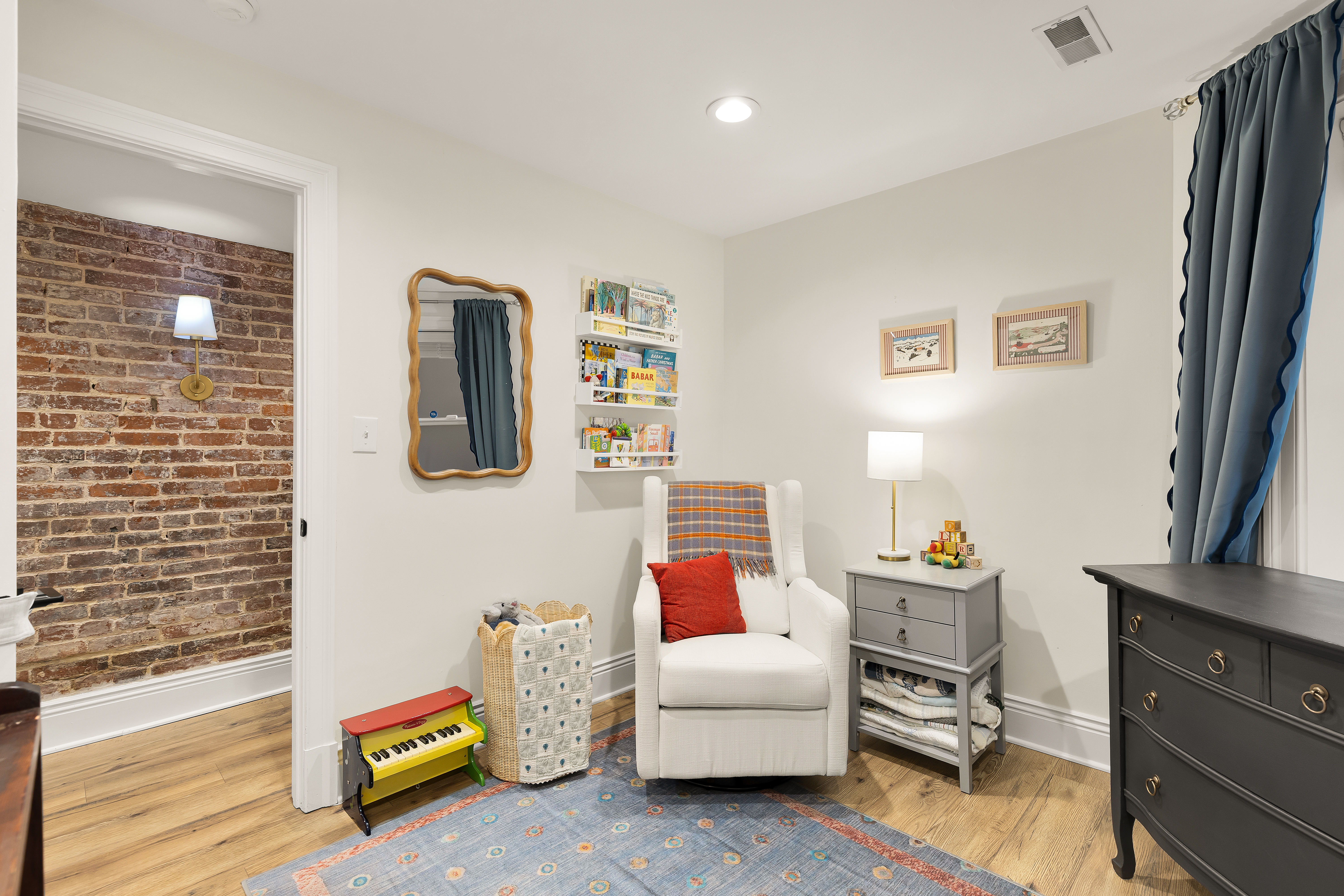 1354 Kenyon Street Northwest, Unit G Washington, DC 20010 - Photo 21 of 35 a bedroom with furniture and a flat screen tv