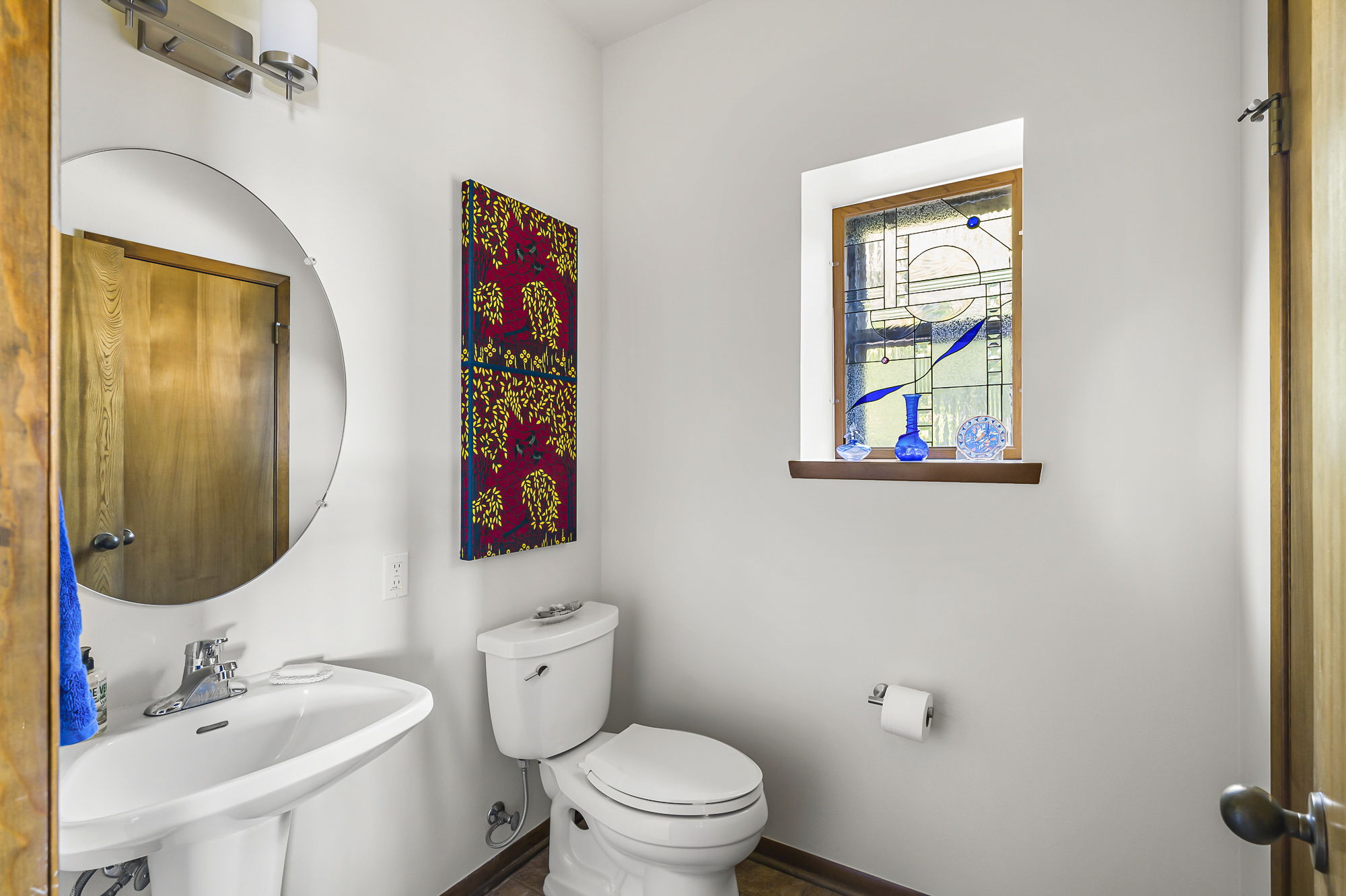 1605 The High Road Austin, TX 78746 - Photo 15 of 45 a bathroom with a toilet sink and mirror