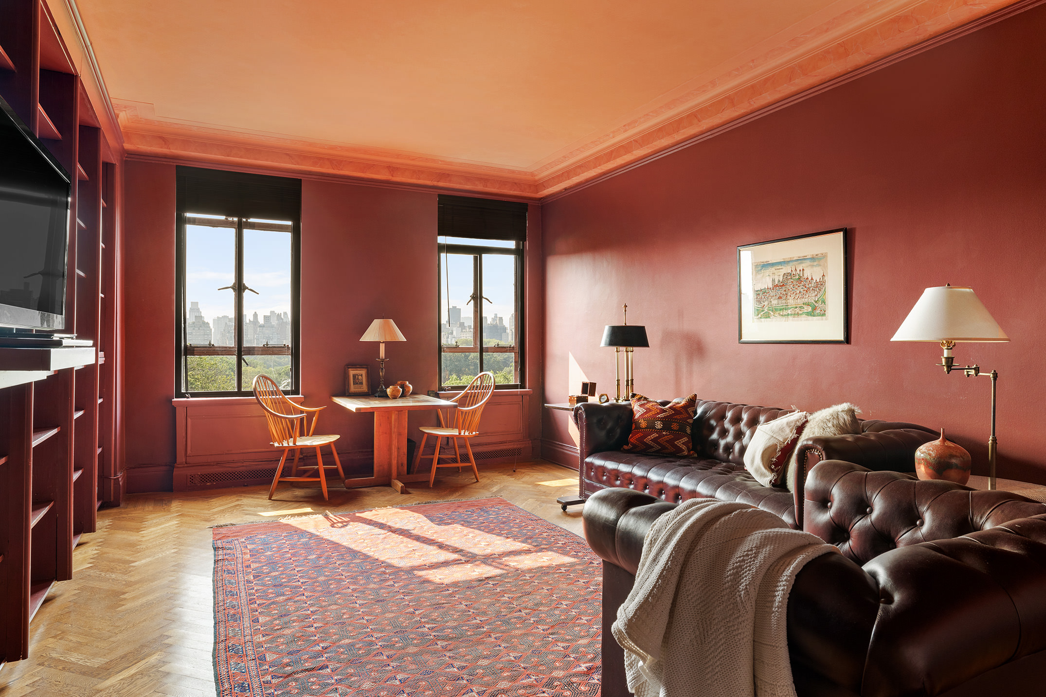 145-146 Central Park West, Unit 8C Manhattan, NY 10023 - Photo 6 of 17 a living room with furniture a lamp and a flat screen tv