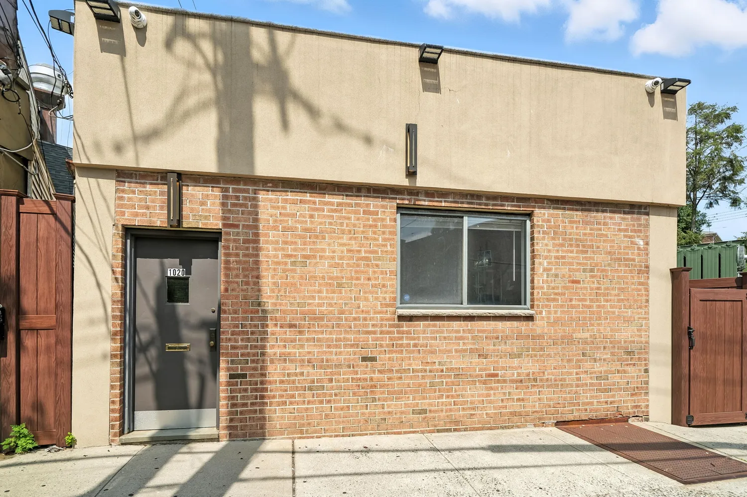 a front view of a house with a glass door