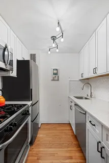 a kitchen with stainless steel appliances a stove and a refrigerator