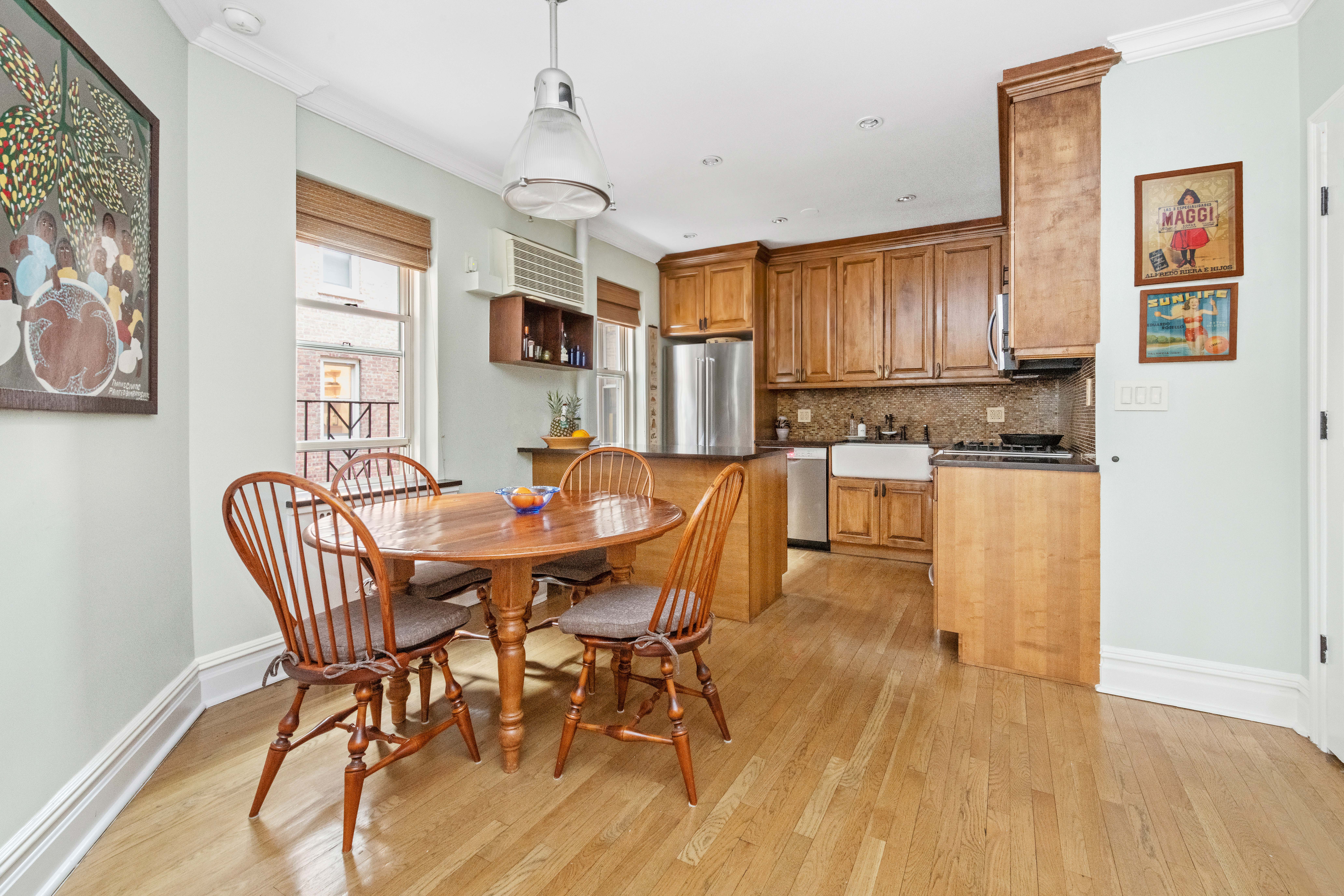 525 East 89th Street, Unit 3A Manhattan, NY 10128 - Photo 3 of 11 a view of a dining room with furniture window and wooden floor