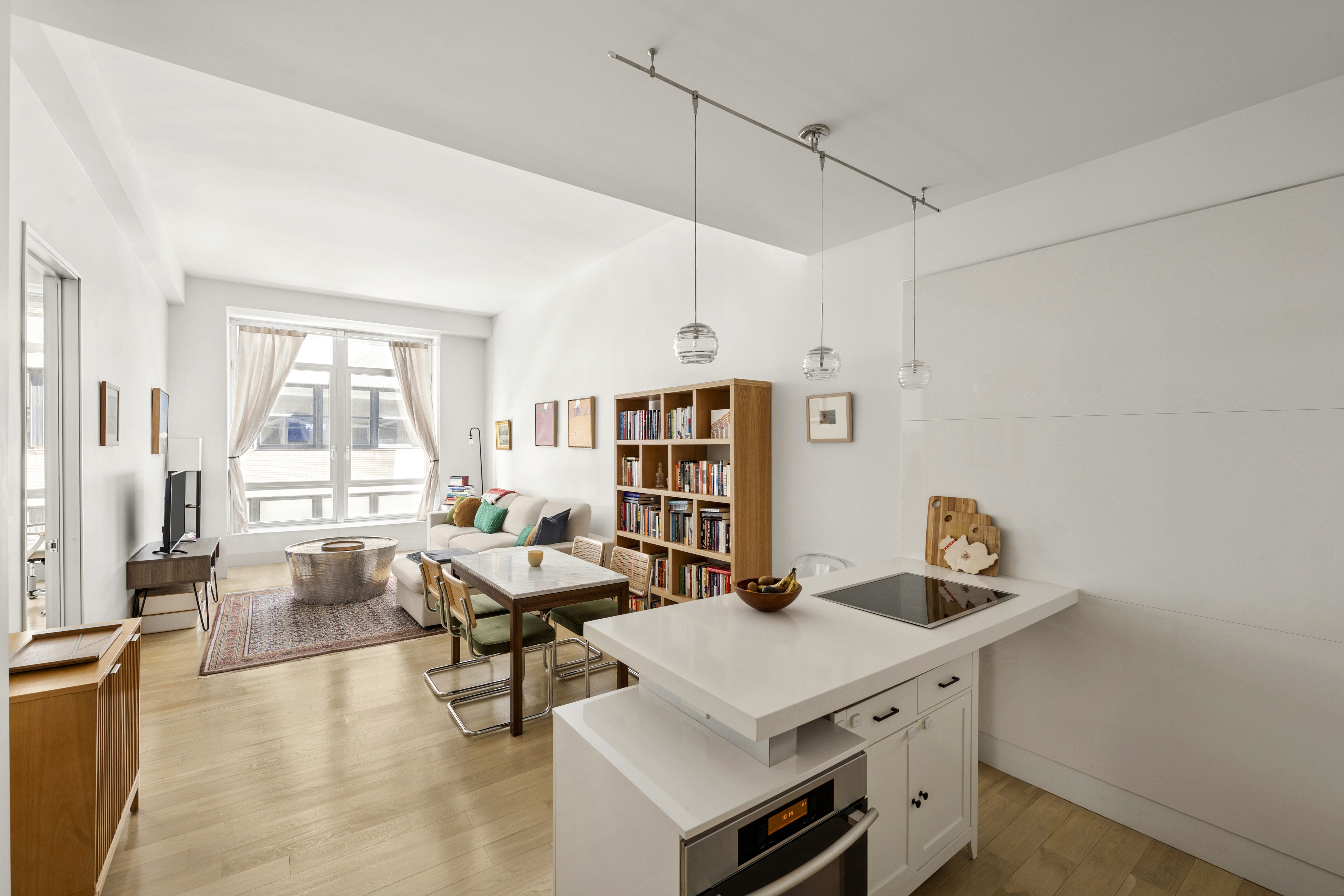 111 Fulton Street, Unit 308 Manhattan, NY 10038 - Photo 1 of 13 a room with furniture and window