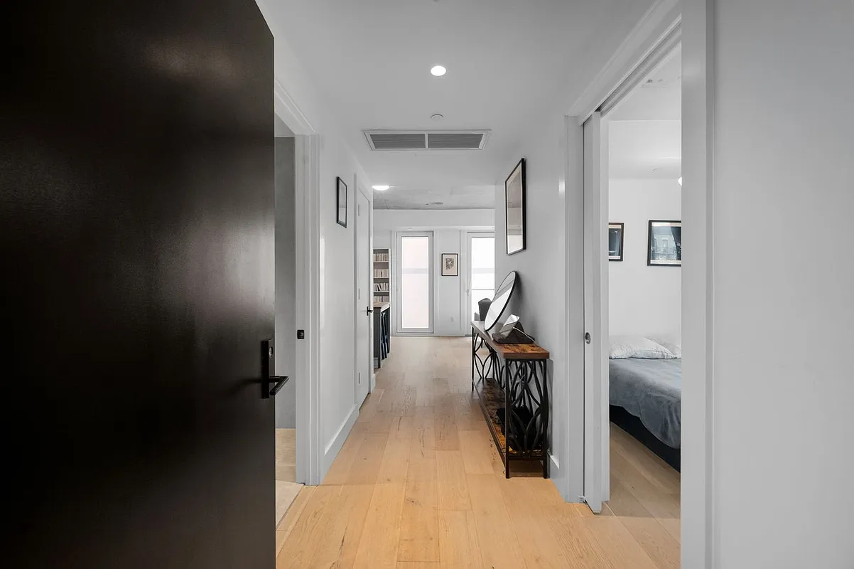 169 Huron Street, Unit 4A Brooklyn, NY 11222 - Photo 11 of 15 a hallway with a view of bedroom with a large window