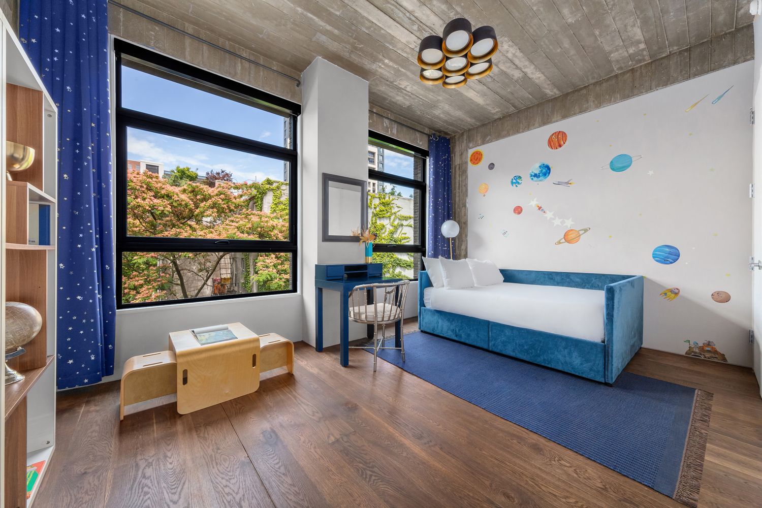 a view of a patio with two chairs and a potted plant