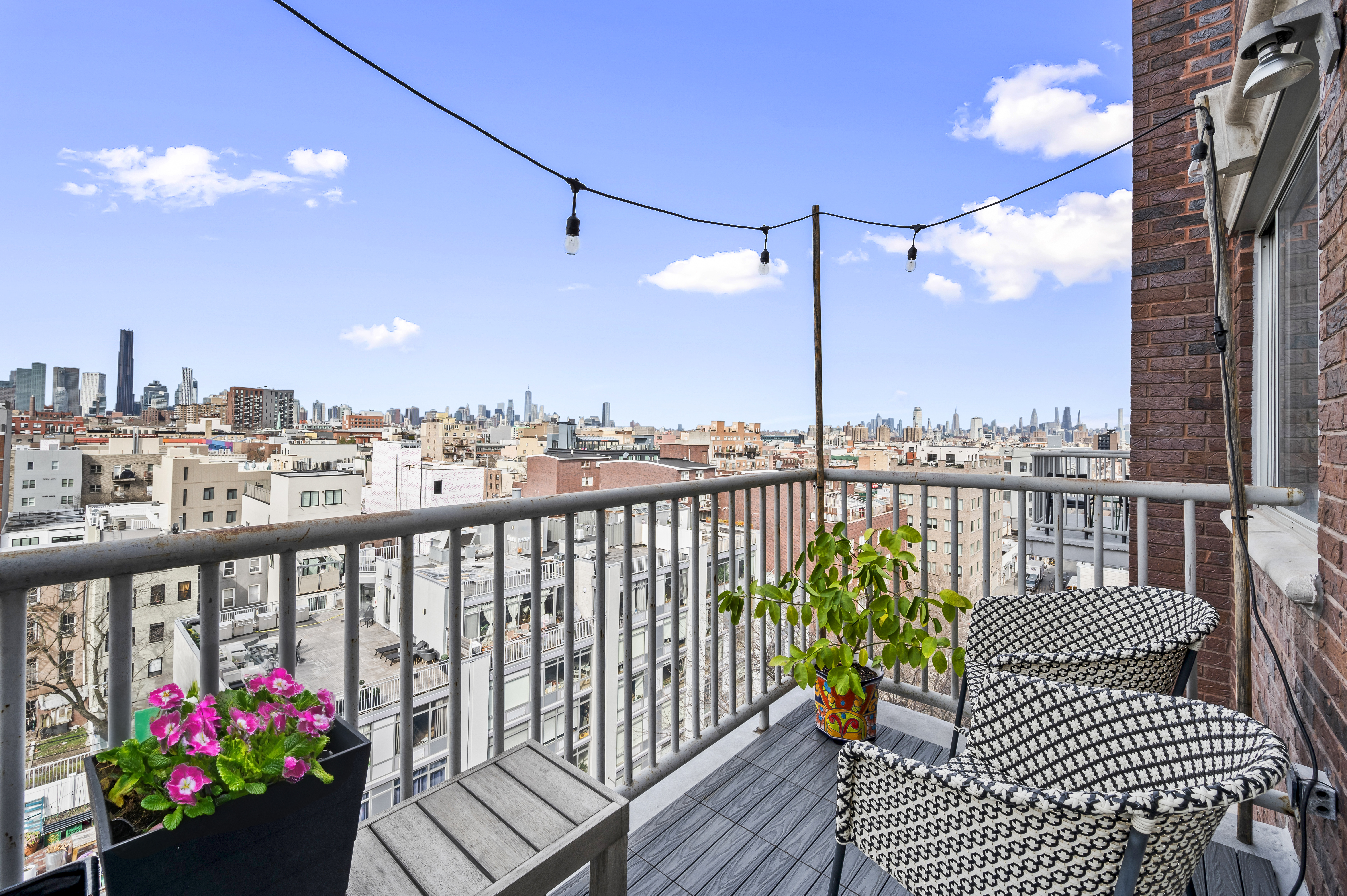 191 Spencer Street, Unit 9A Brooklyn, NY 11205 - Photo 2 of 10 a view of a balcony with wooden benches
