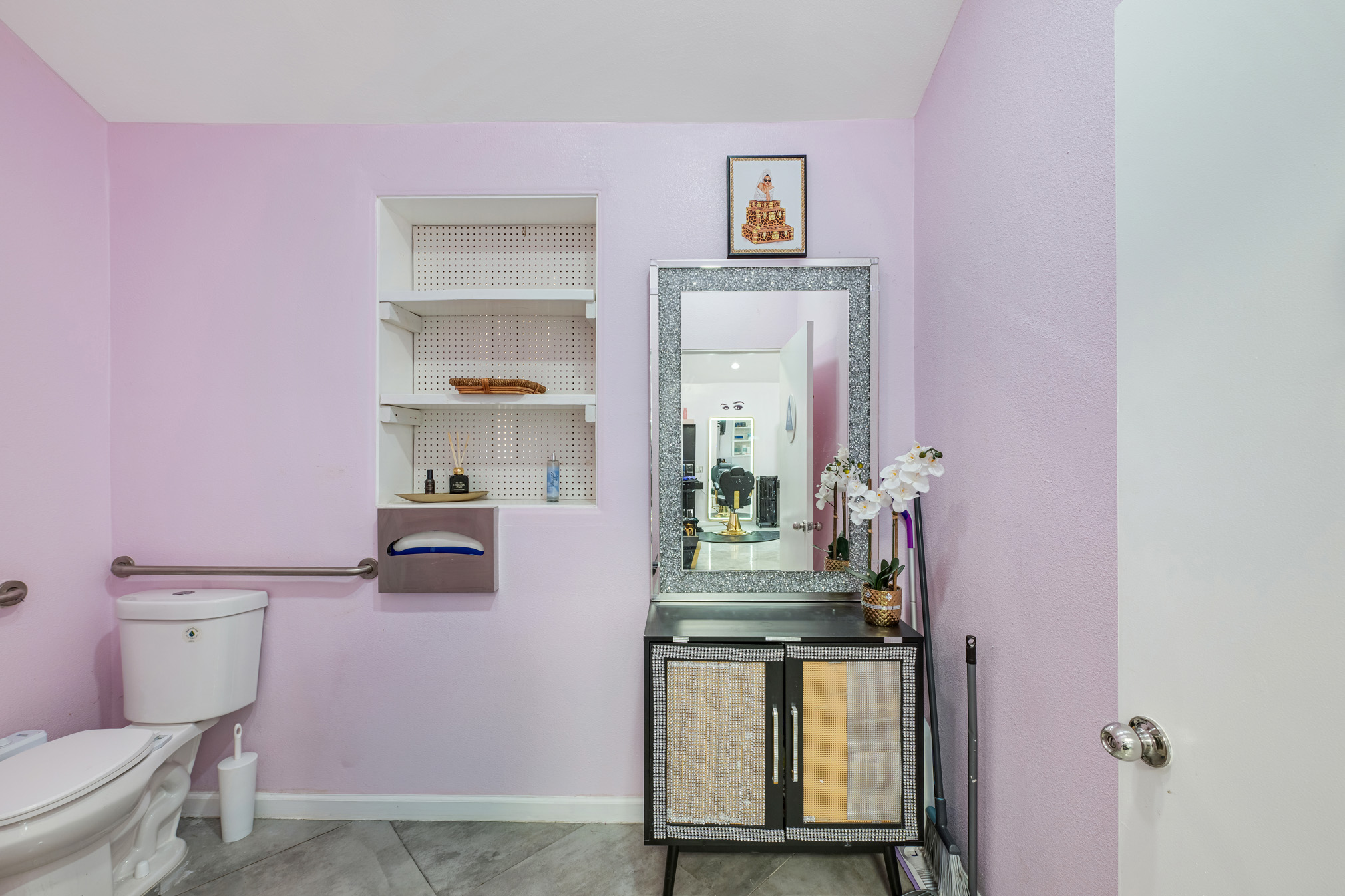 451 Iowa Avenue Riverside, CA 92507 - Photo 11 of 13 a bathroom with a granite countertop toilet sink and mirror