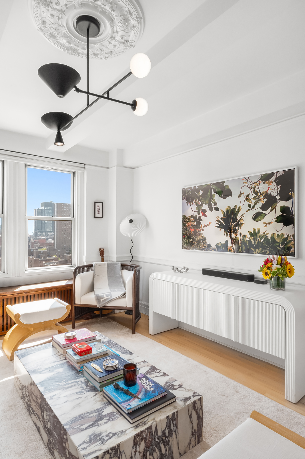 365 West 20th Street, Unit 14B Manhattan, NY 10011 - Photo 3 of 21 a living room with furniture and view of kitchen