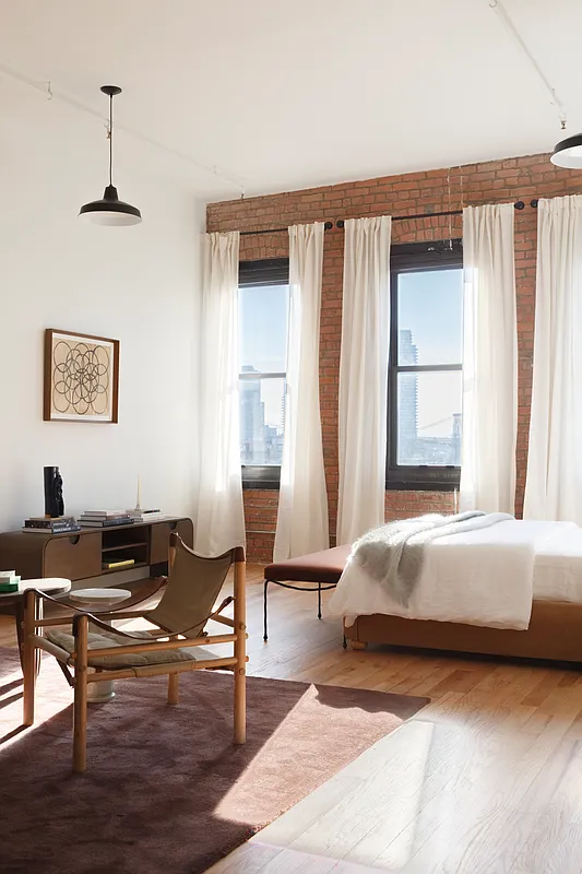 239 Banker Street, Unit 4K Brooklyn, NY 11222 - Photo 4 of 13 a living room with a bed furniture and a window