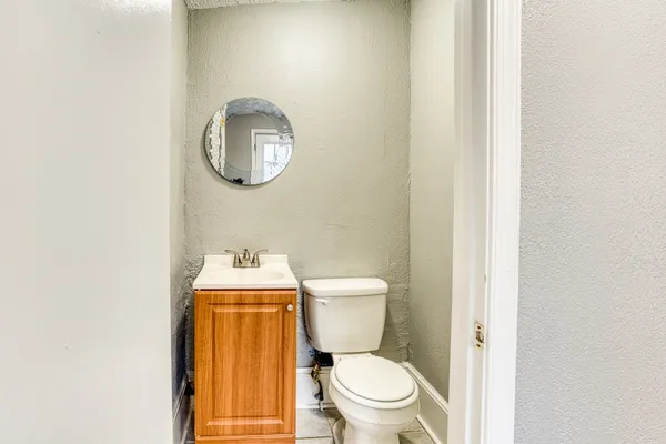 a bathroom with a toilet and a sink