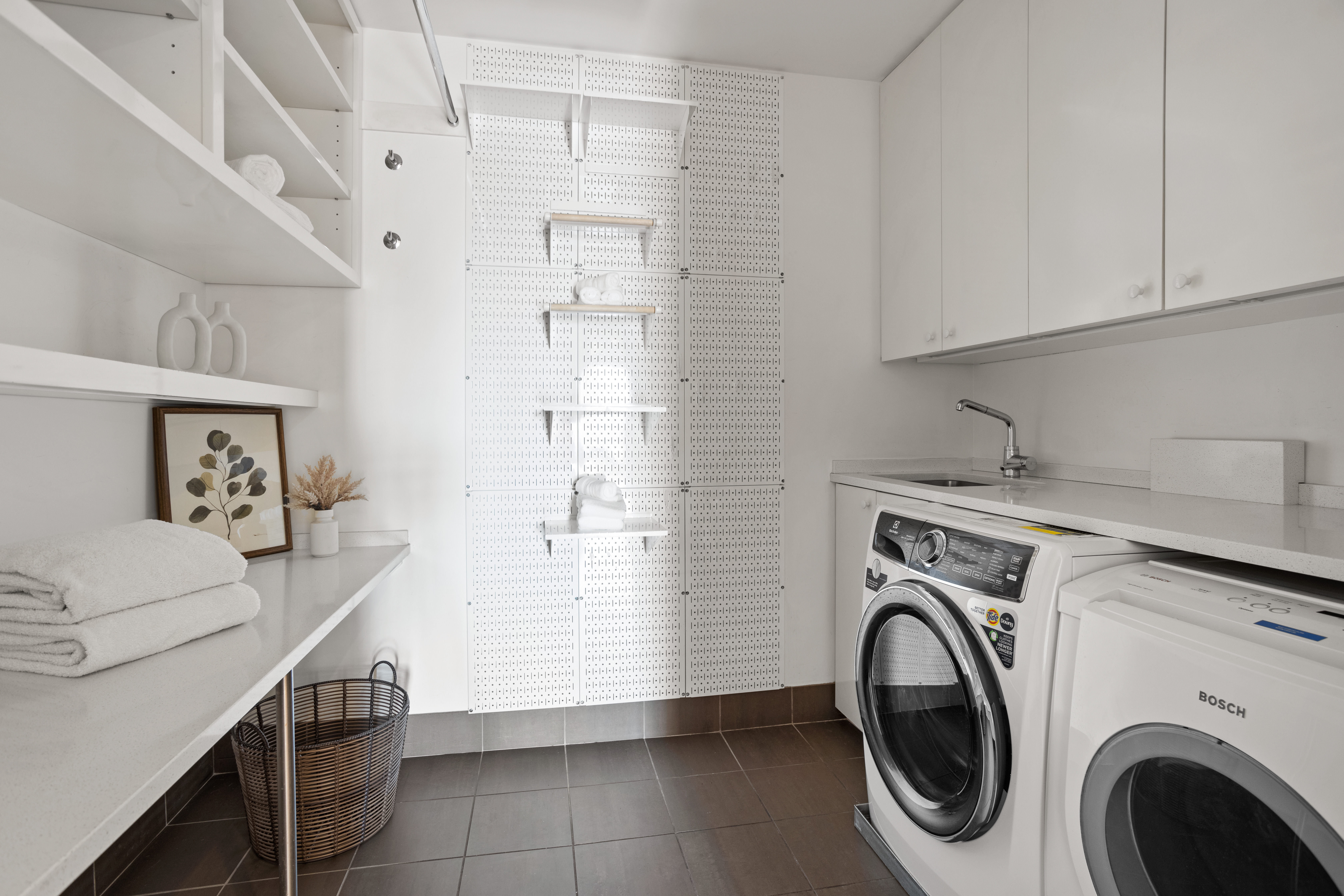 255 East 74th Street, Unit 21B Manhattan, NY 10021 - Photo 23 of 40 a utility room with dryer and washer