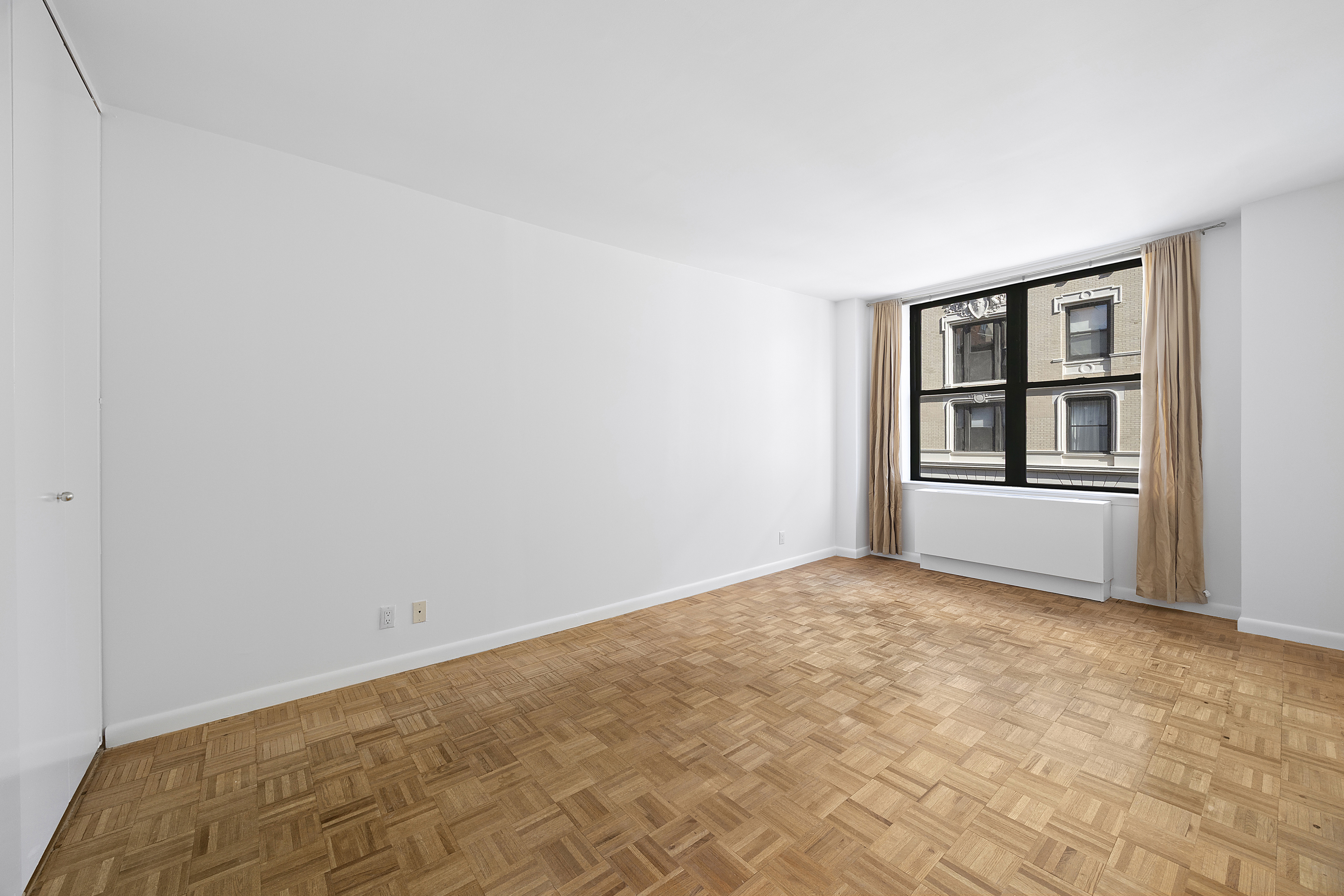 2250 Broadway, Unit 5H Manhattan, NY 10024 - Photo 5 of 9 an empty room with windows