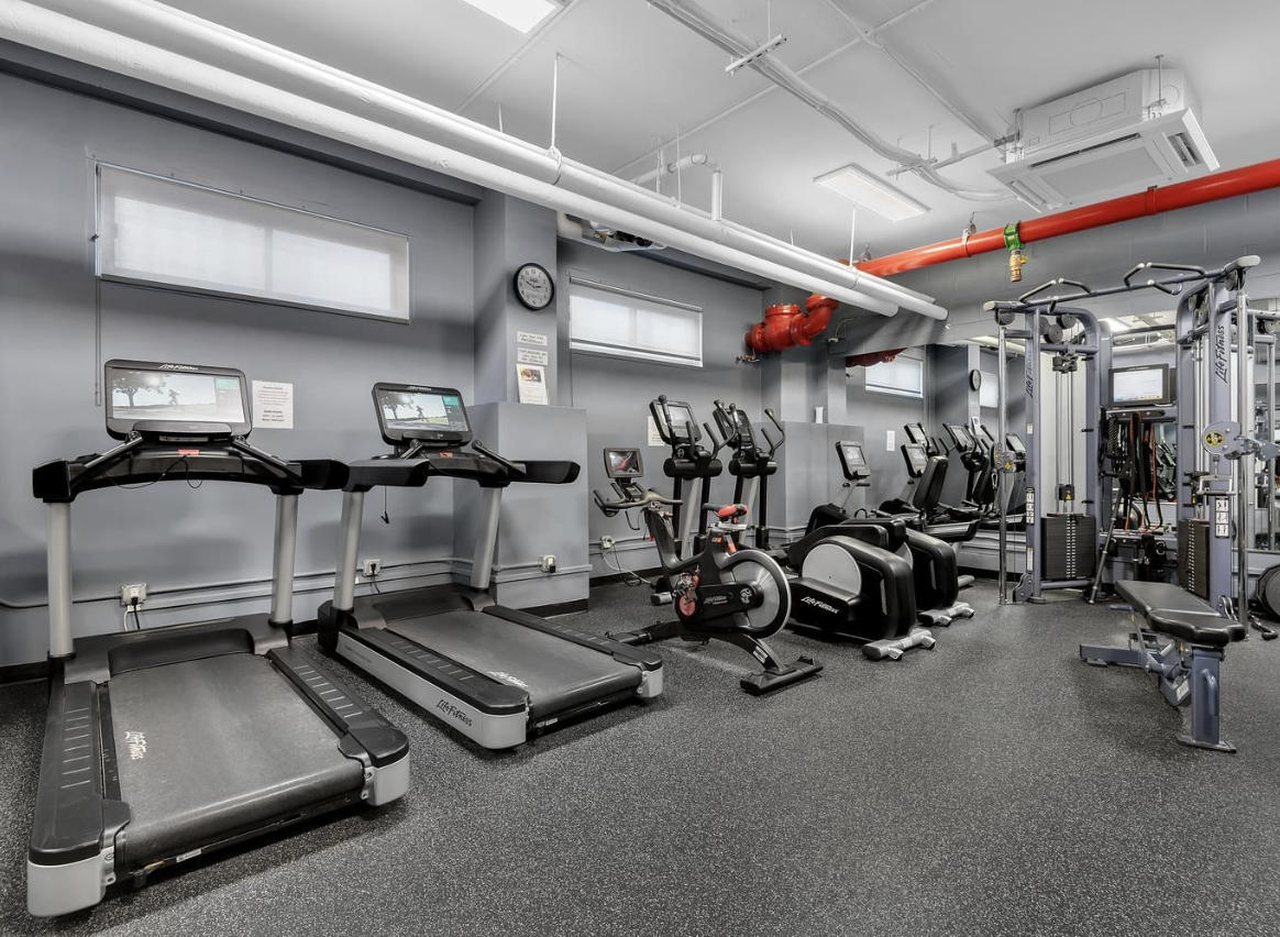 303 West 66th Street, Unit 6BW Manhattan, NY 10023 - Photo 9 of 12 a view of a room with gym equipment
