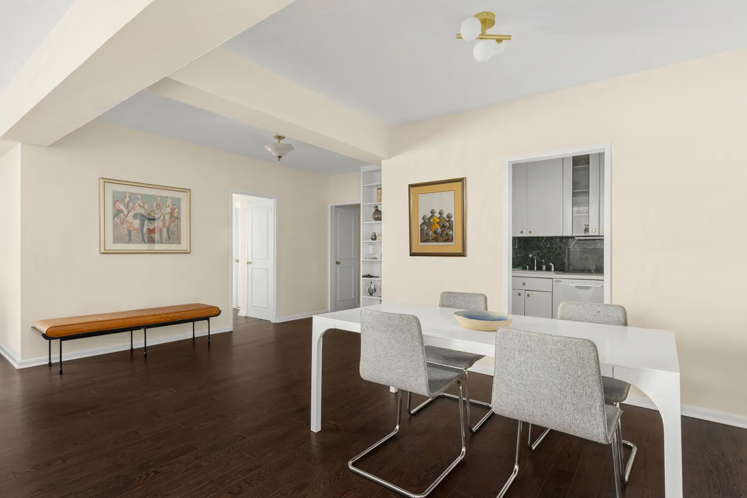 a dining room with furniture and wooden floor