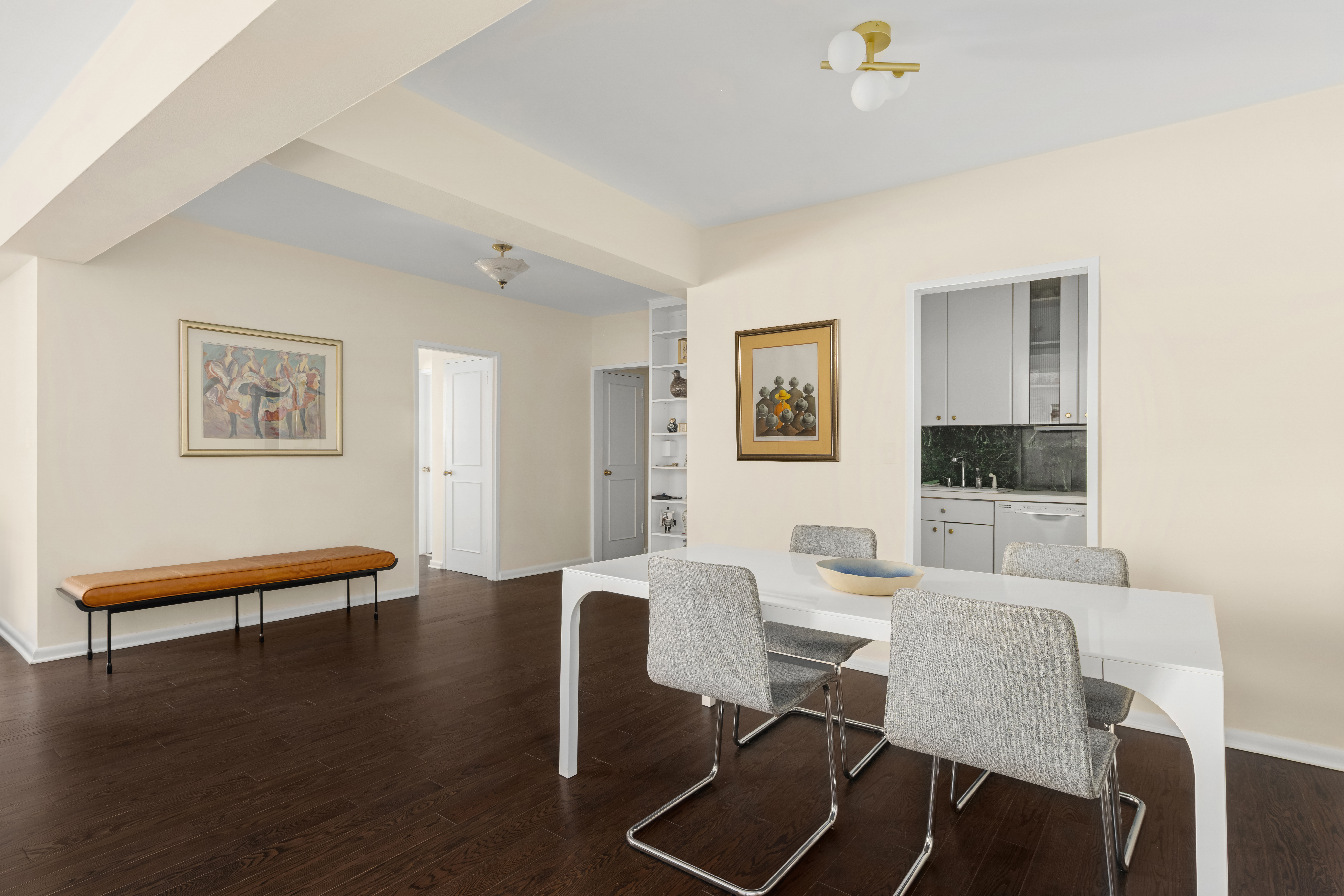 25 Sutton Place South, Unit 18L Manhattan, NY 10022 - Photo 4 of 11 a dining room with furniture and wooden floor