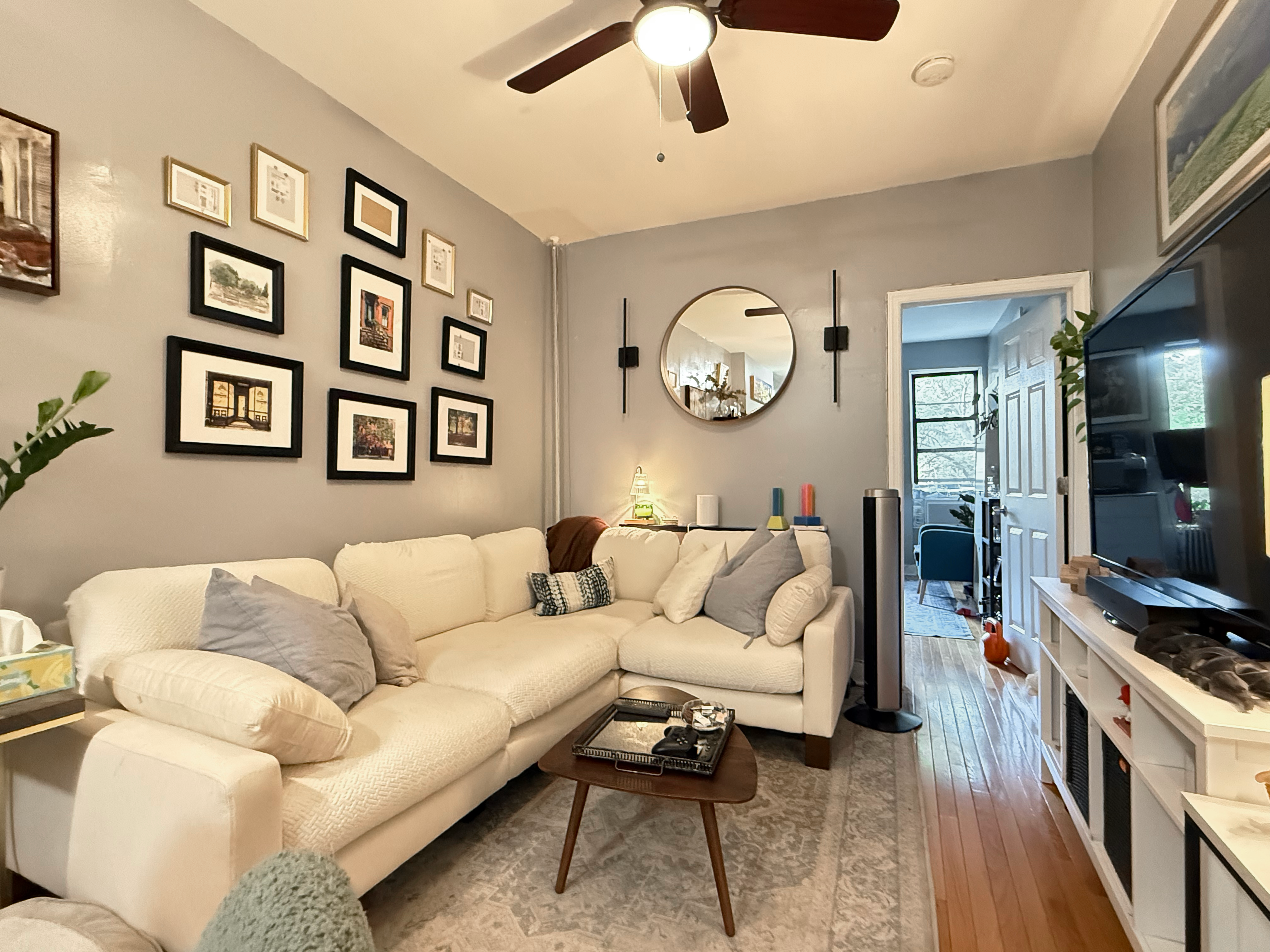 630 President Street, Unit 3 Brooklyn, NY 11215 - Photo 4 of 10 a living room with furniture and a flat screen tv