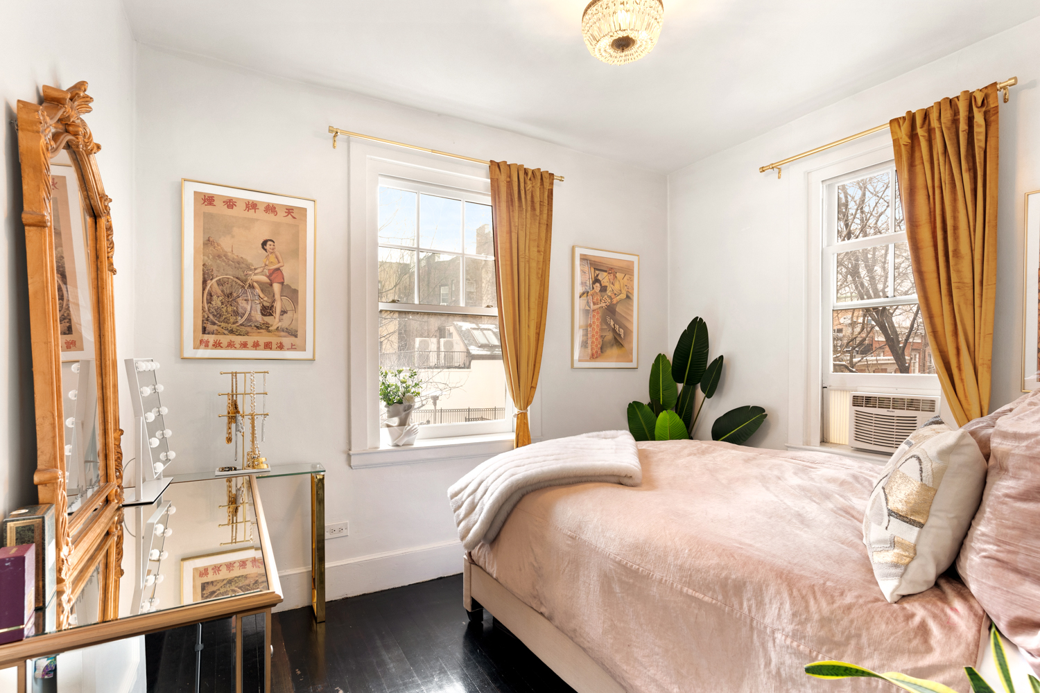 78 Bedford Street, Unit 4C Manhattan, NY 10014 - Photo 6 of 10 a bedroom with a bed and wooden floor