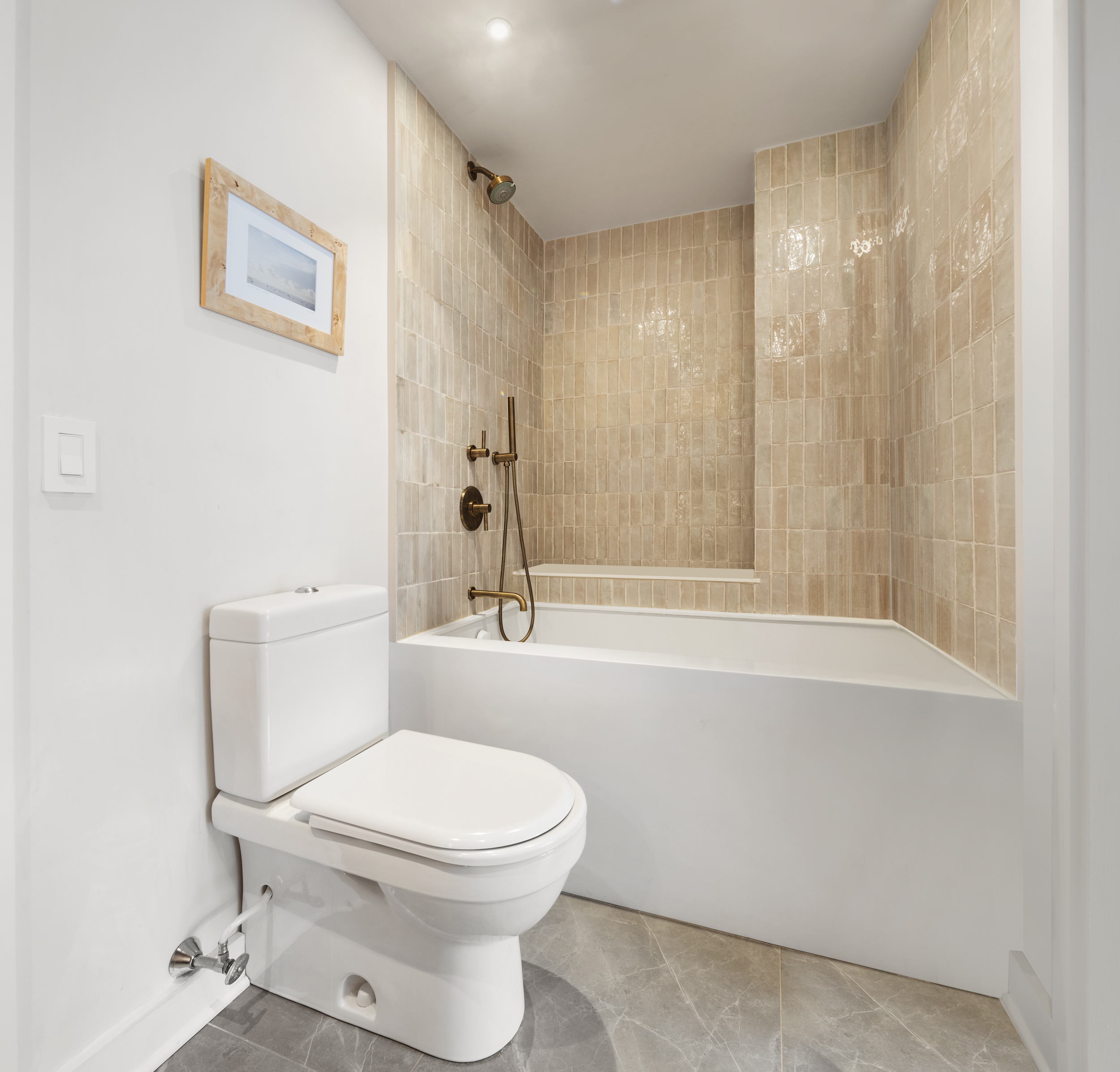 2 Horatio Street, Unit 4JS Manhattan, NY 10014 - Photo 11 of 20 a white toilet sitting next to a bath tub