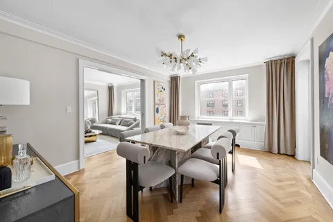 a view of a dining room with furniture and window