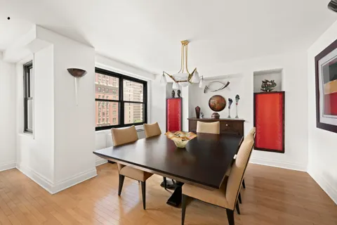 a view of a dining room with furniture and window