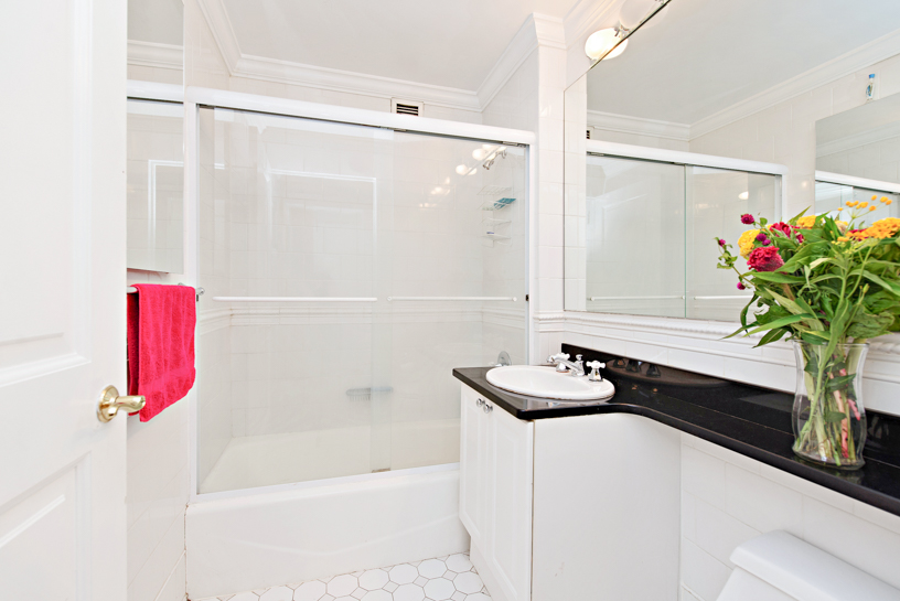 400 East 90th Street, Unit 7E Manhattan, NY 10128 - Photo 6 of 12 a bathroom with a bathtub and a shower