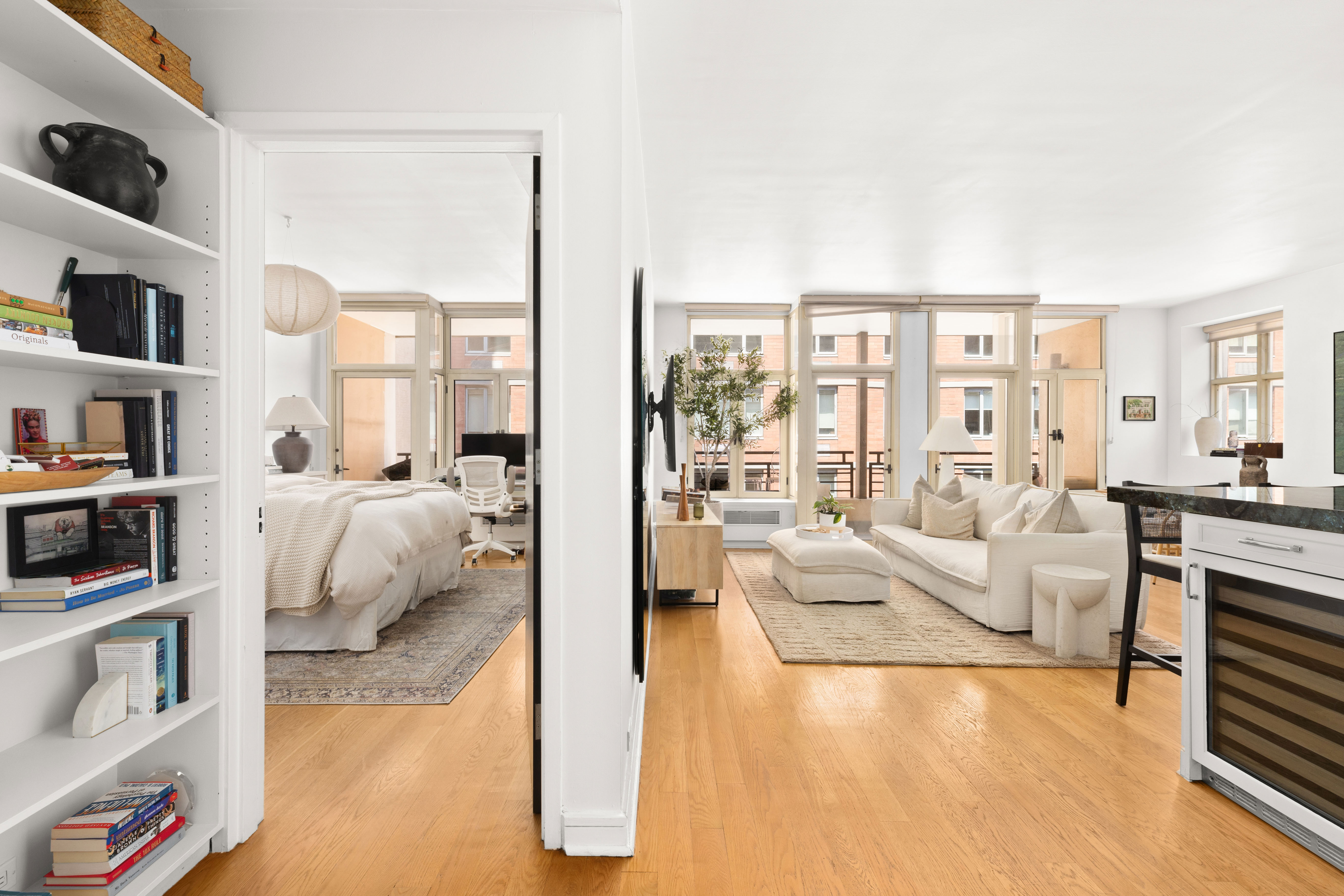129 West 20th Street, Unit 5C Manhattan, NY 10011 - Photo 4 of 12 a living room with furniture and a large window