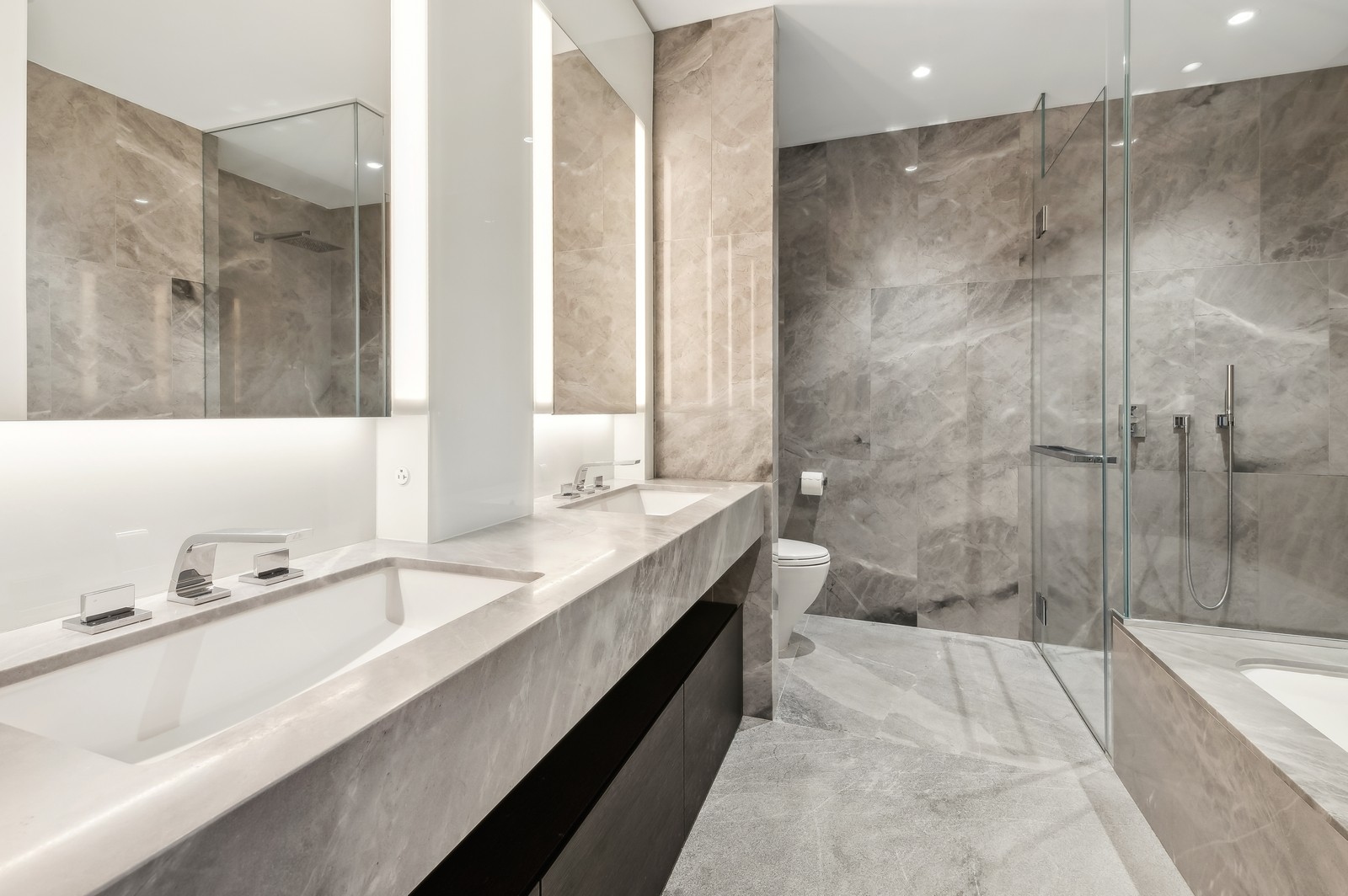 15 Hudson Yards, Unit 74F Manhattan, NY 10001 - Photo 7 of 13 a spacious bathroom with a tub sink and mirror