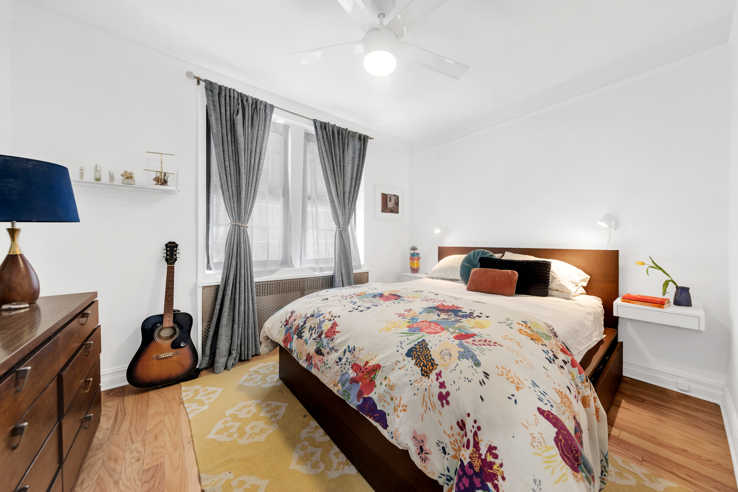 385 Argyle Road, Unit 1B Brooklyn, NY 11218 - Photo 7 of 11 a bedroom with a bed and a flat tv screen on the dresser