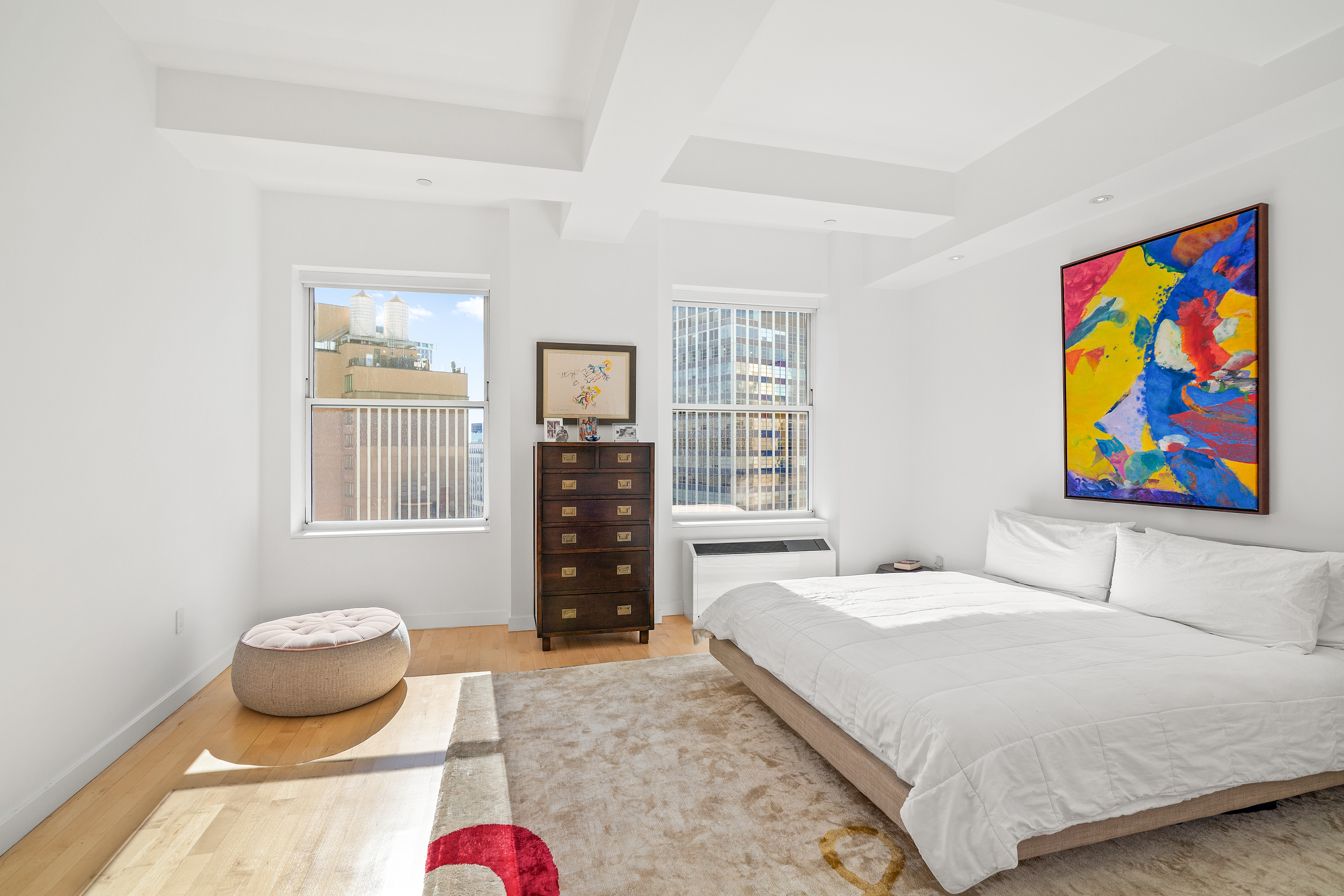 15 Broad Street, Unit 3120 Manhattan, NY 10005 - Photo 5 of 15 a bedroom with a bed and glass window