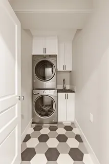 a kitchen with a stove a sink and a washer