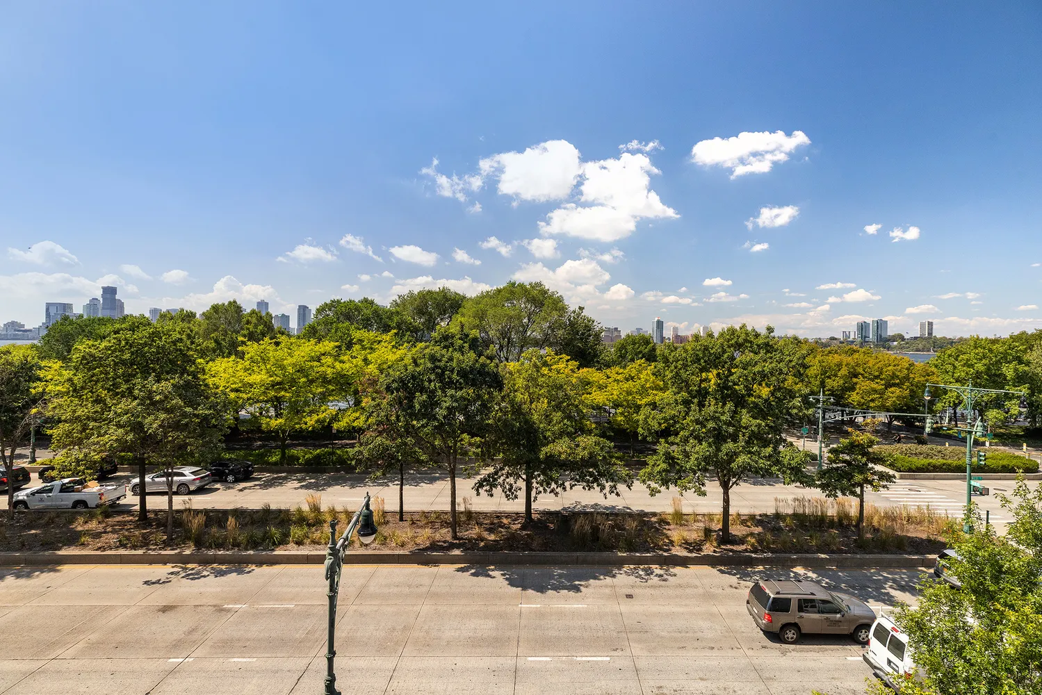 a street view with residential building and trees around