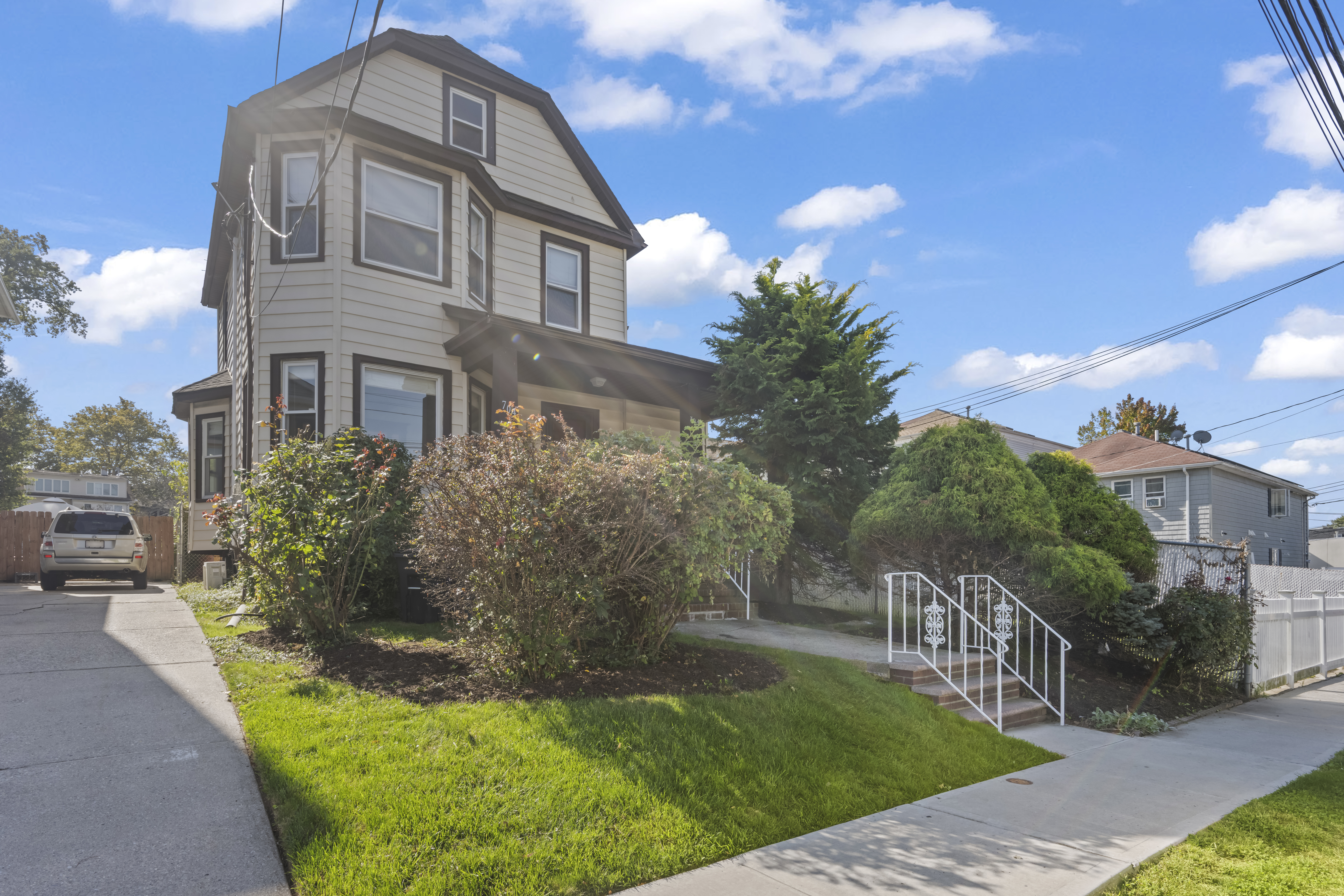 704 Delafield Avenue Staten Island, NY 10310 - Photo 2 of 35 a front view of a house with a yard