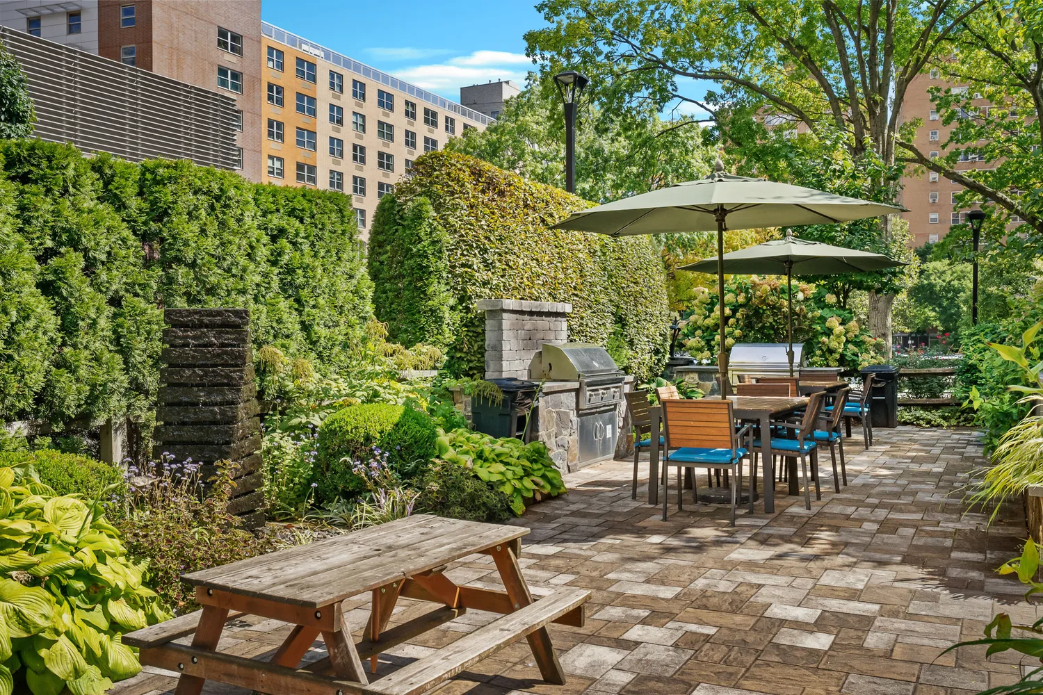 an outdoor space with patio and white umbrellas