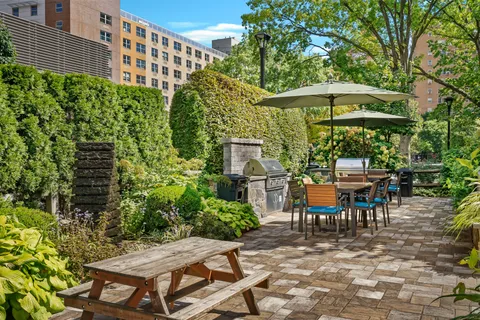 an outdoor space with patio and white umbrellas