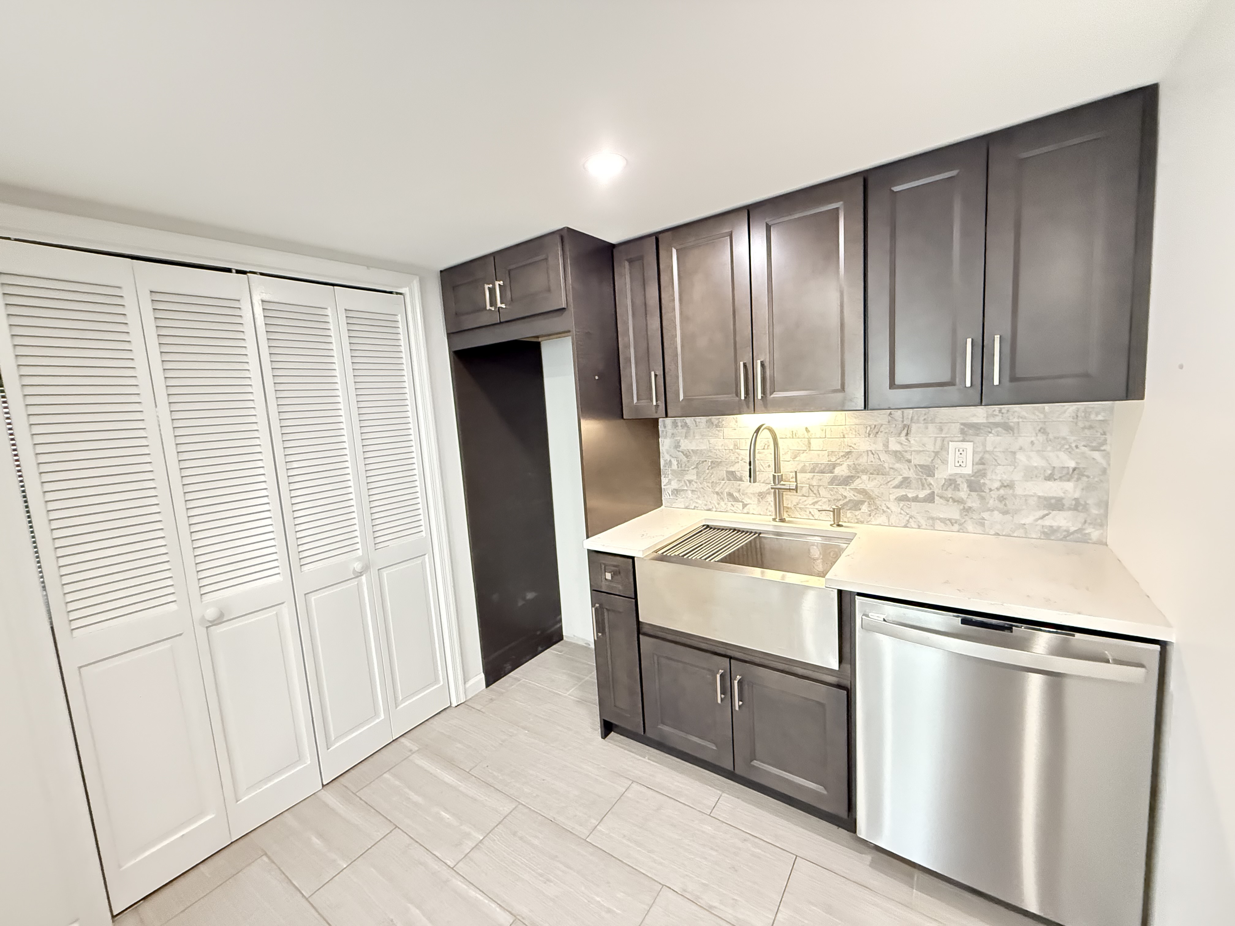 3236 Country Club Road Bronx, NY 10465 - Photo 18 of 22 a kitchen with a sink stove and refrigerator