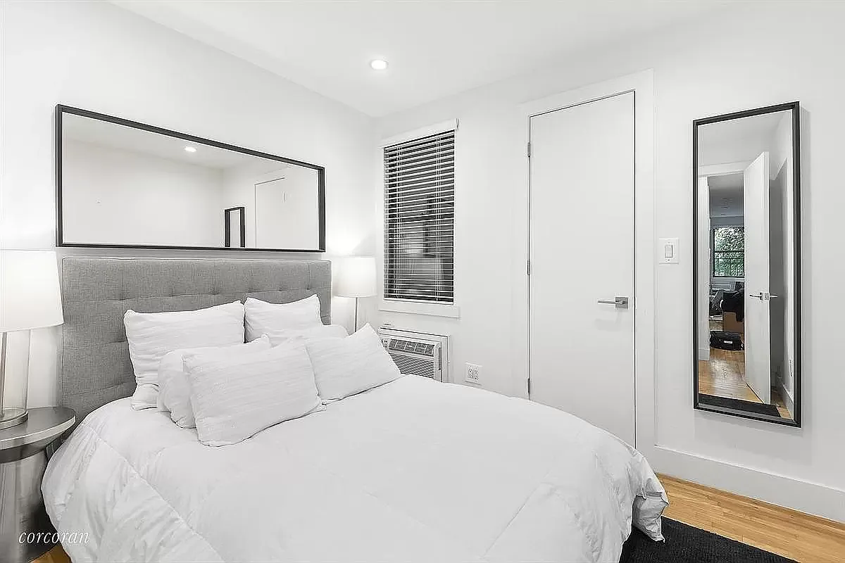 228 East 81st Street, Unit 7A Manhattan, NY 10028 - Photo 3 of 7 a bedroom with a bed and a painting on the wall