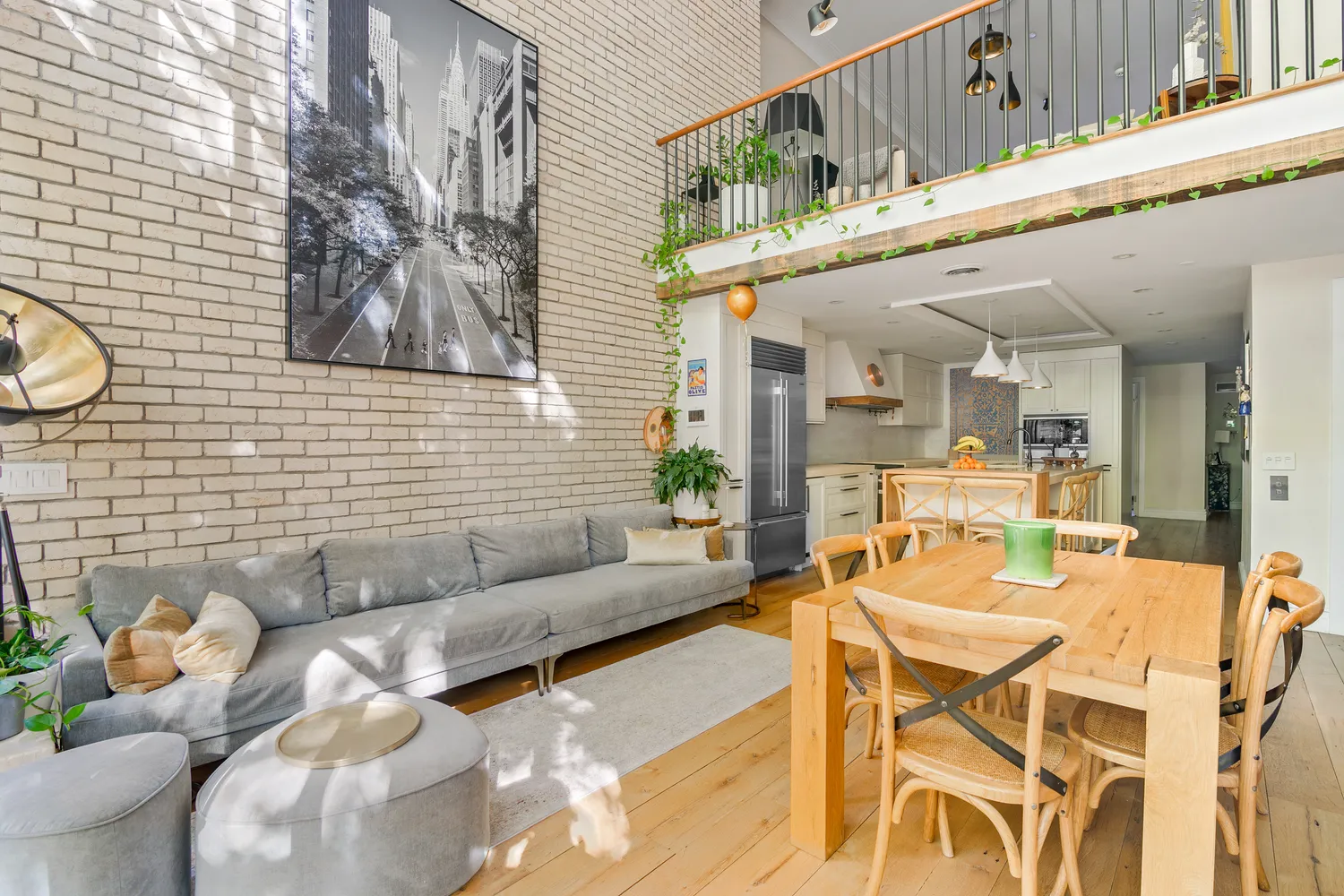 a view of a dining room with furniture and a kitchen