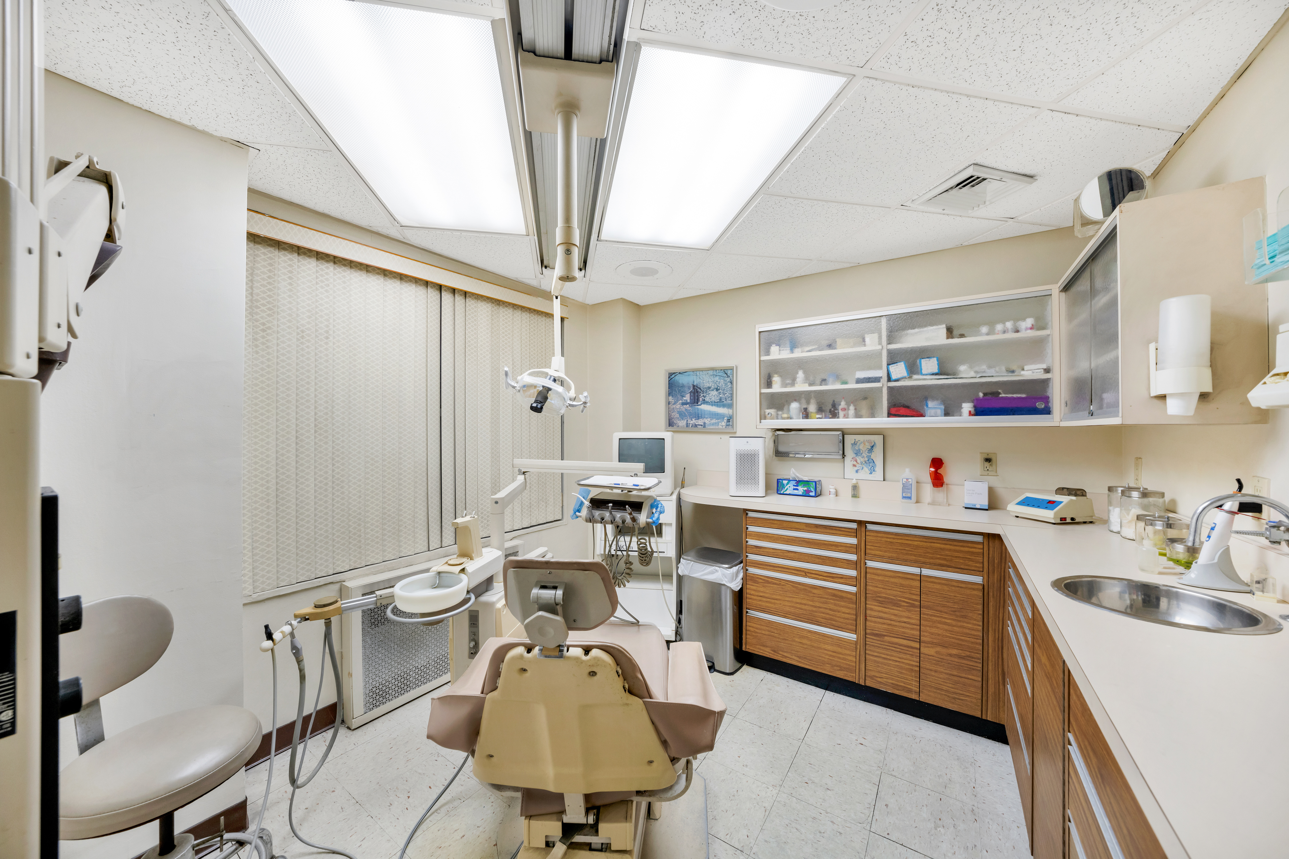 440 East 79th Street, Unit 1D Manhattan, NY 10075 - Photo 4 of 5 a kitchen with a sink and cabinets